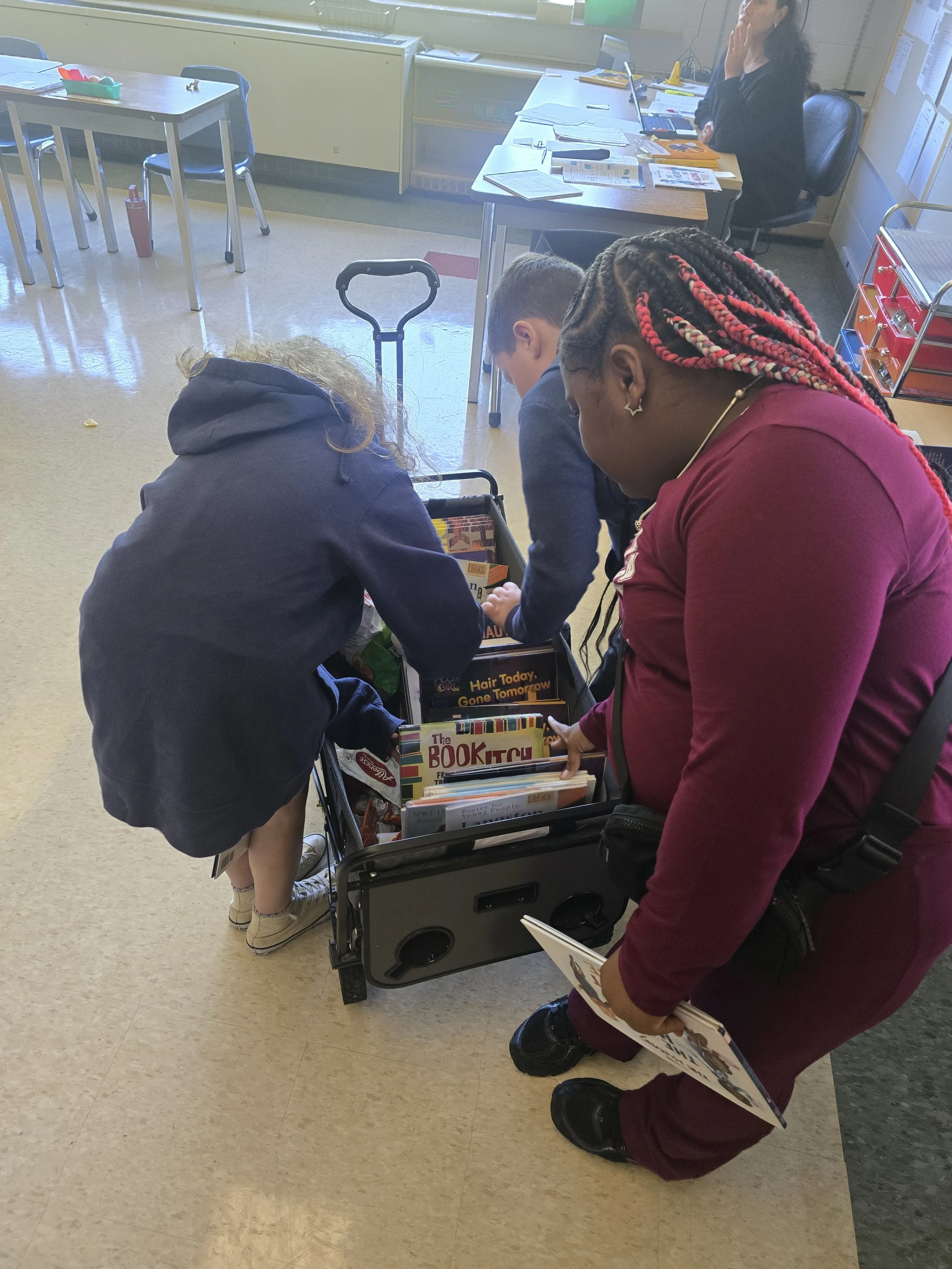 Students at Erickson Elementary choose a book to add to their home library during a Topaze Reading Circle storytime with Ms. K. 