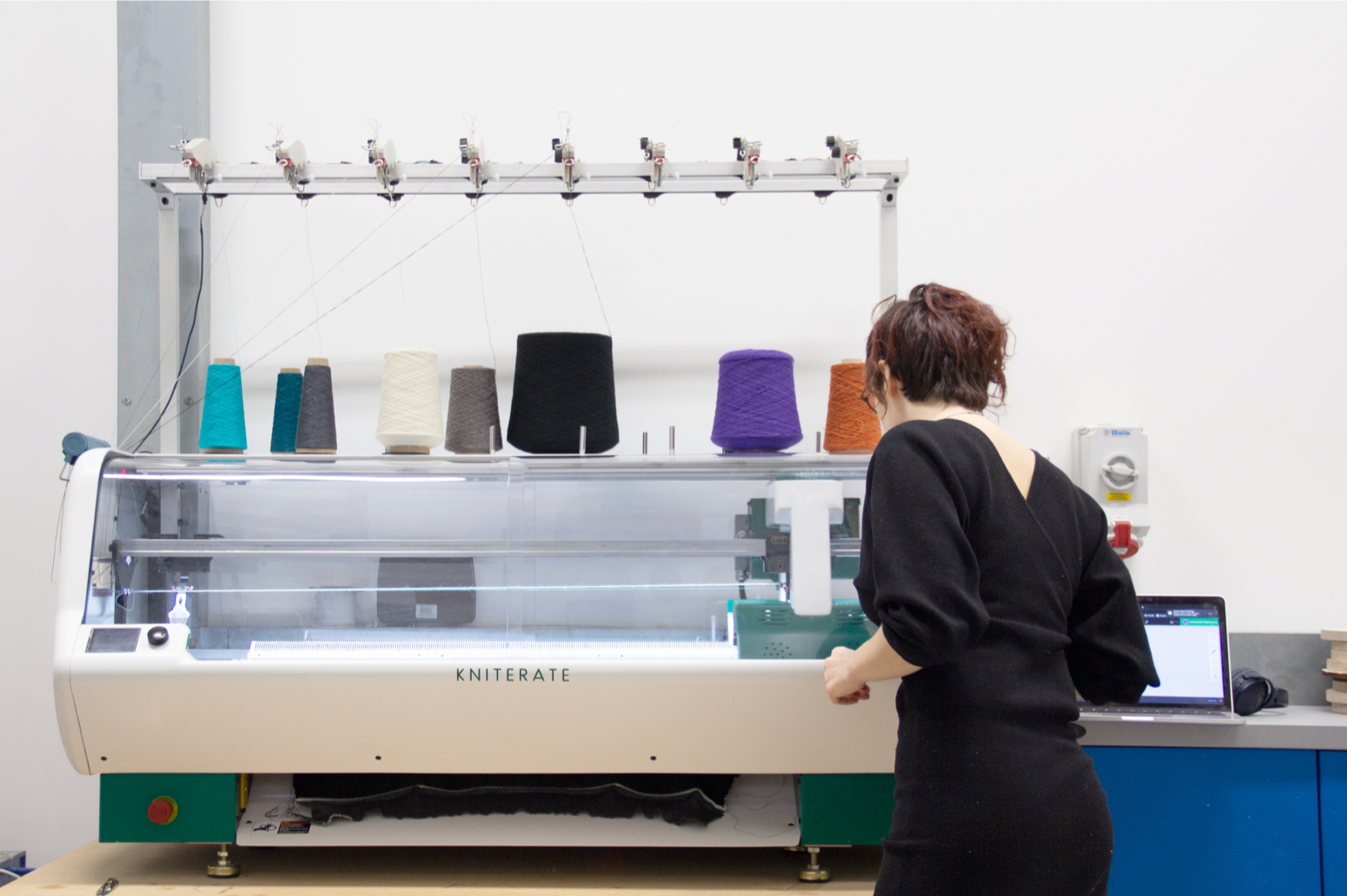 Nikoletta using kniterate - a CNC knitting machine to produce textiles