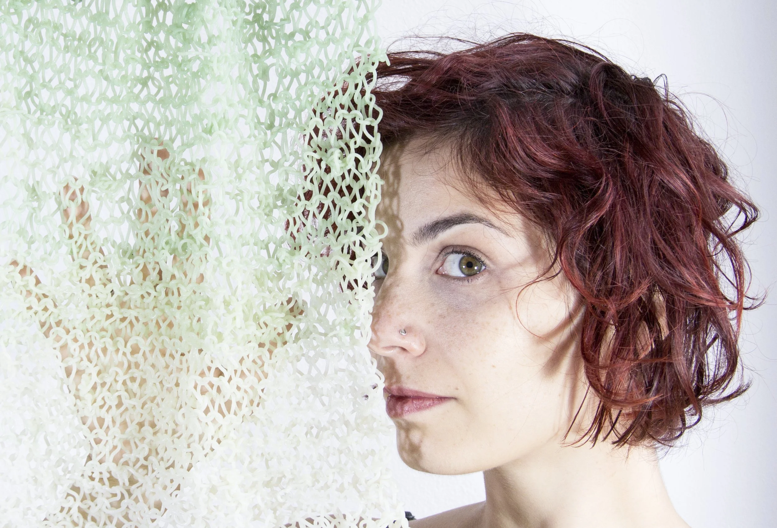 Nikoletta Karastathi next to a bio textile made ou too boyars infused with algae