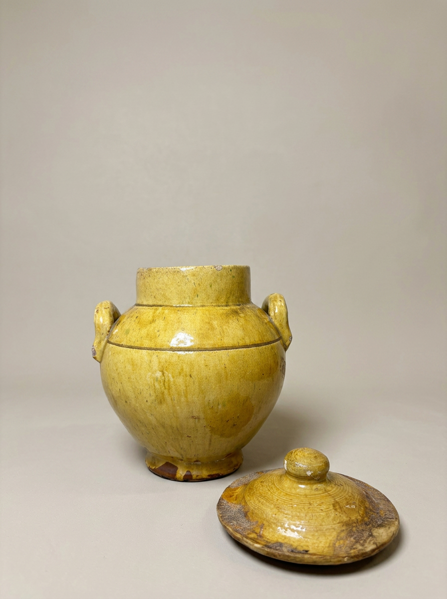yellow glazed rustic pot with lid