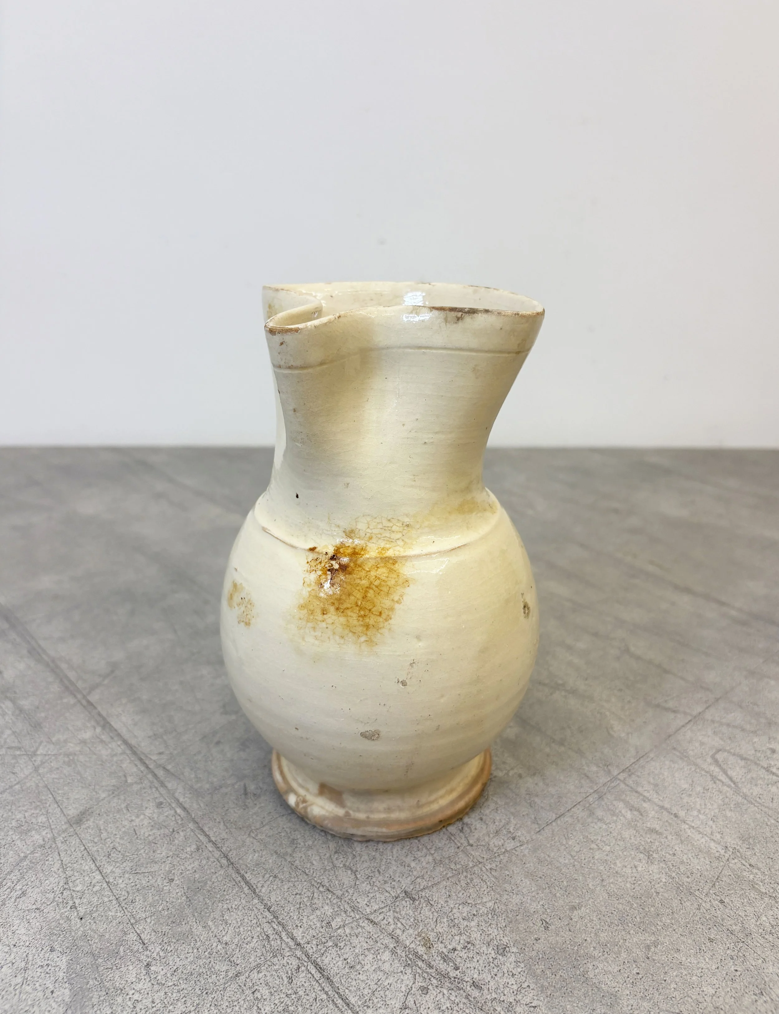antique cream glazed ceramic pitcher