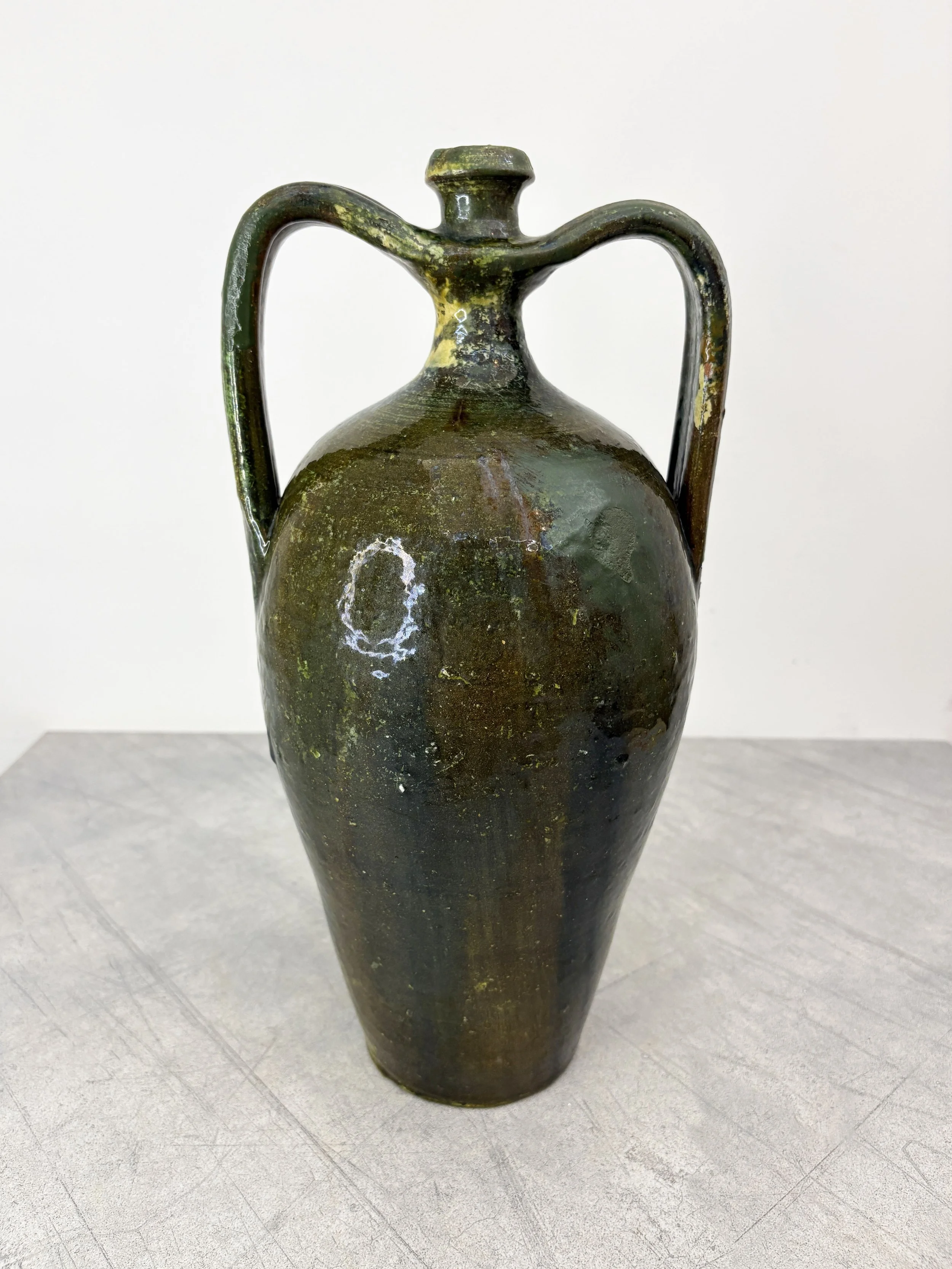 antique green ceramic amphora