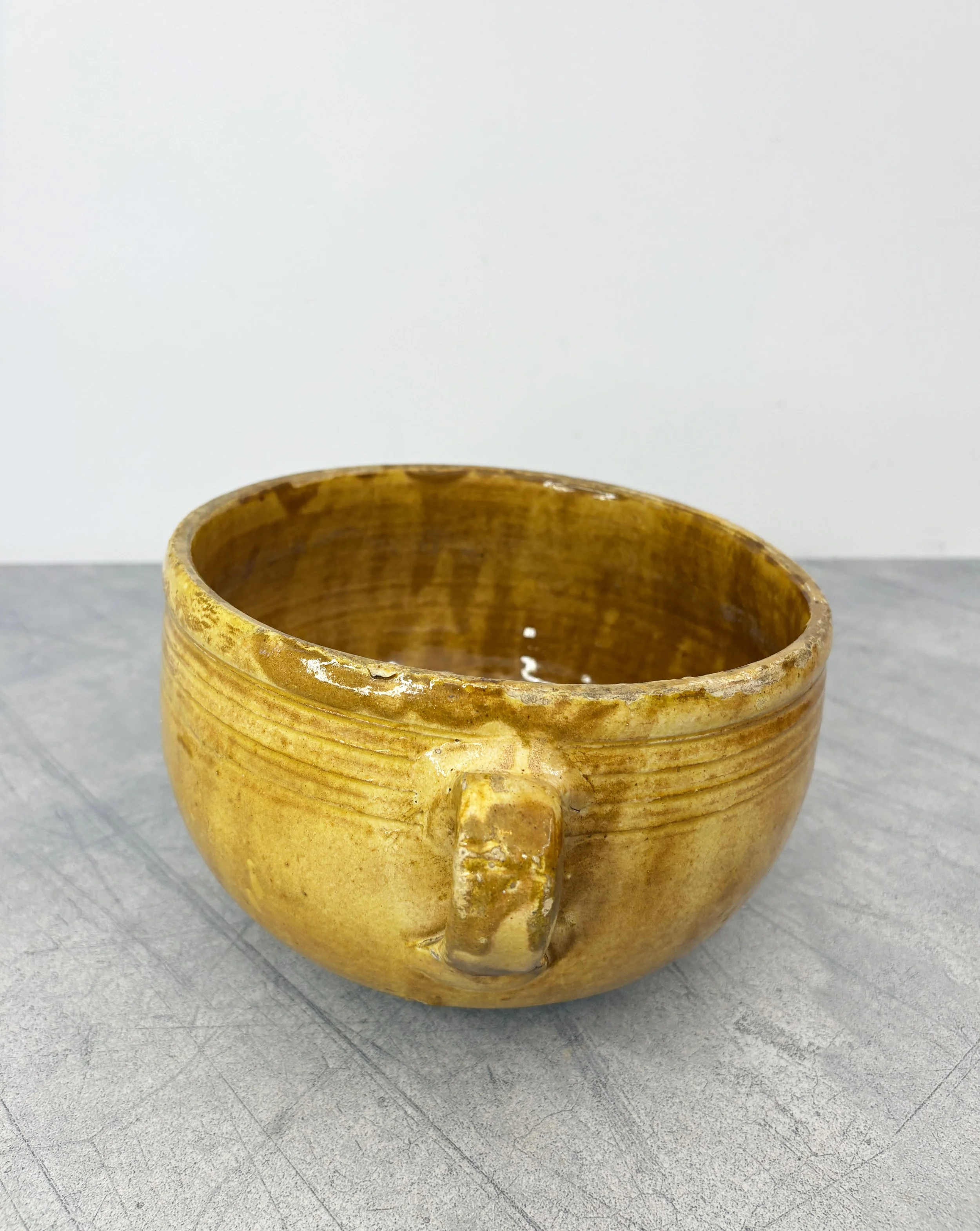 antique yellow glazed ceramic colander