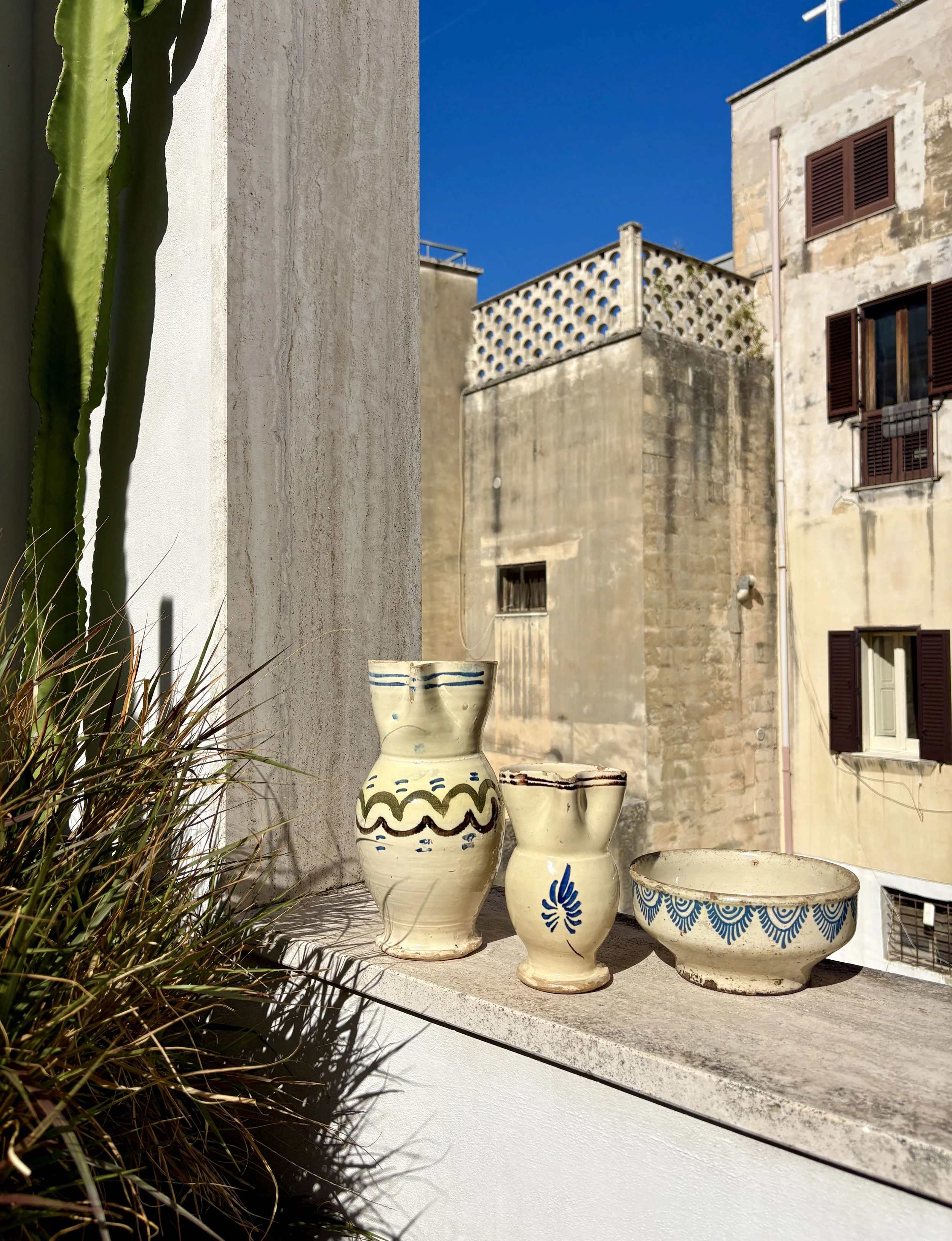rustic southern Italian blue and cream hand painted pottery