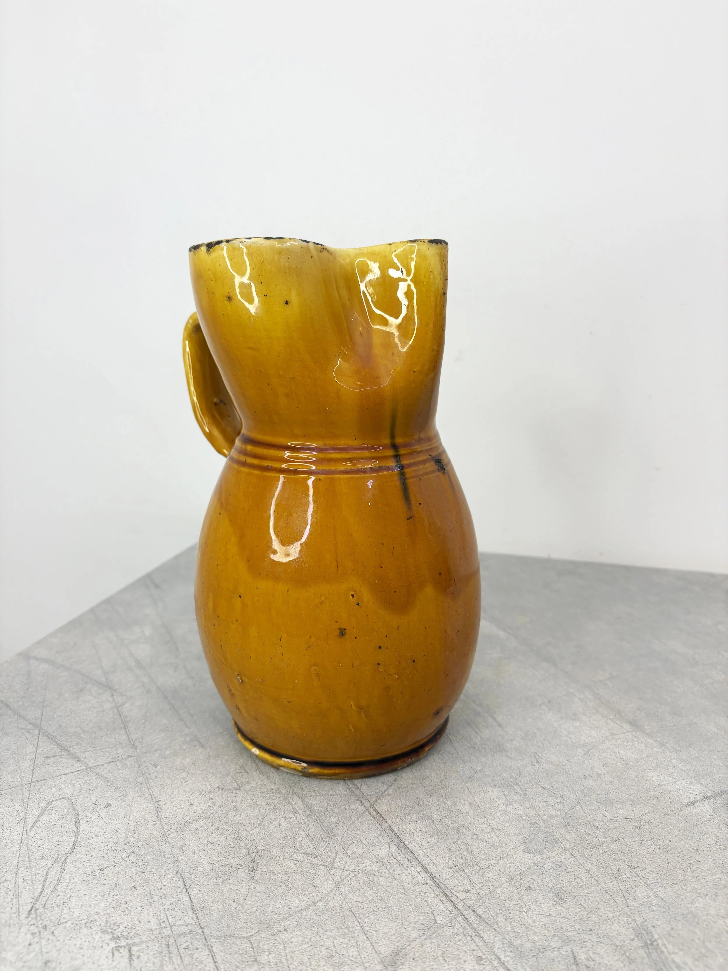 large orange glazed ceramic jug