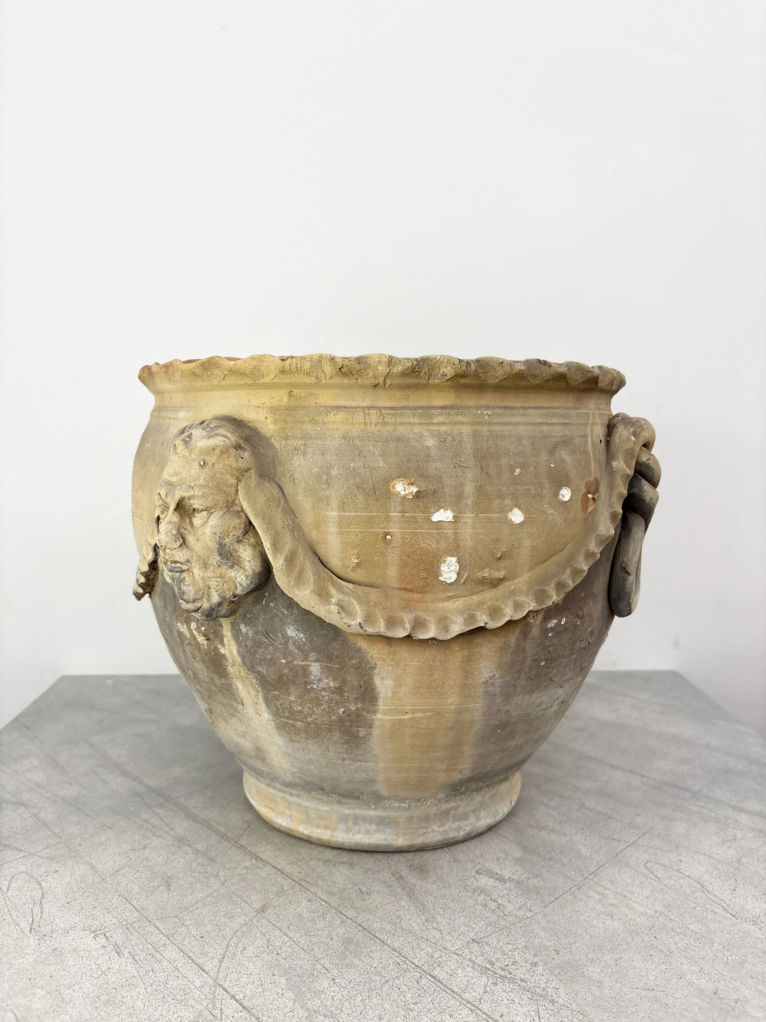 antique rustic plant pot with face