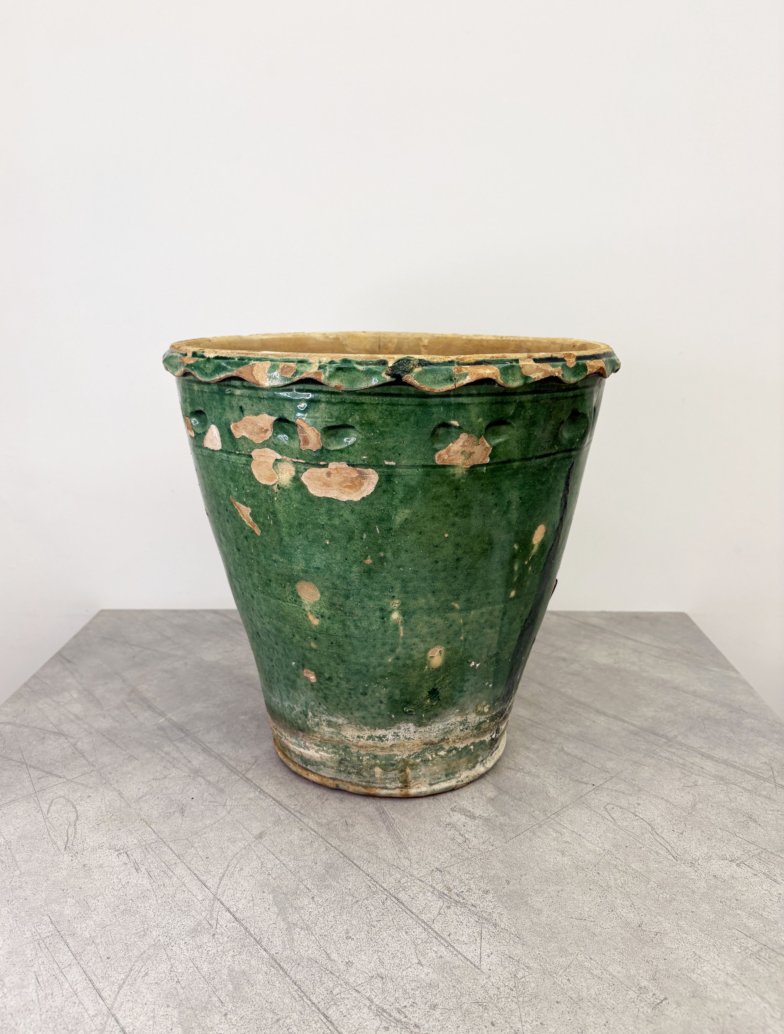 rustic plant pot with green glaze