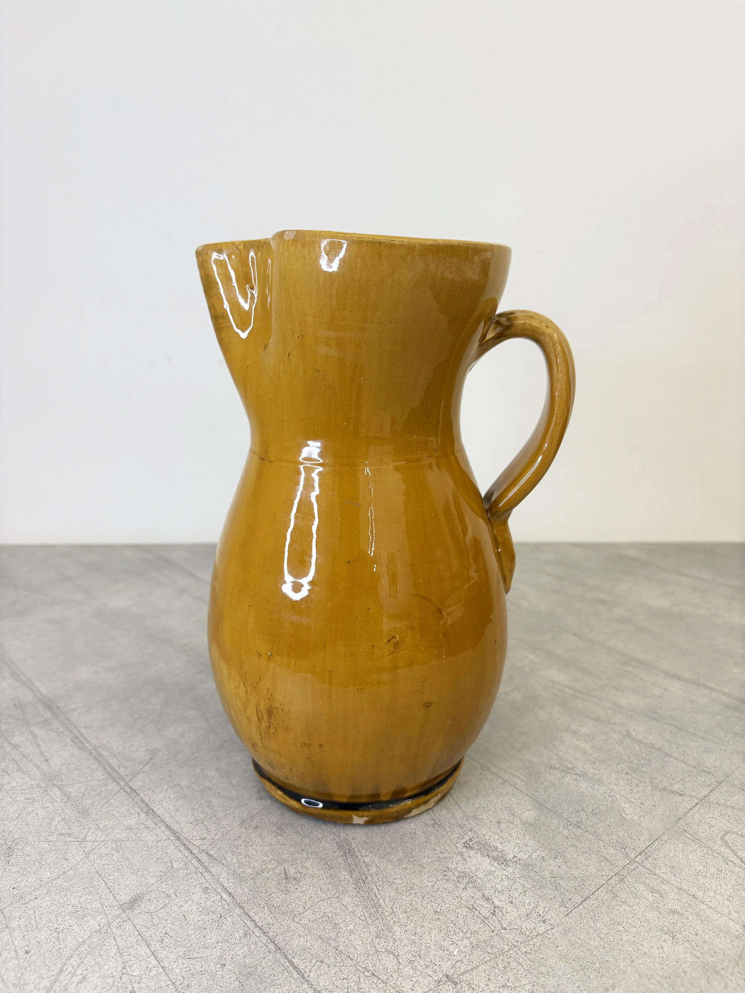 large yellow ceramic jug from Puglia