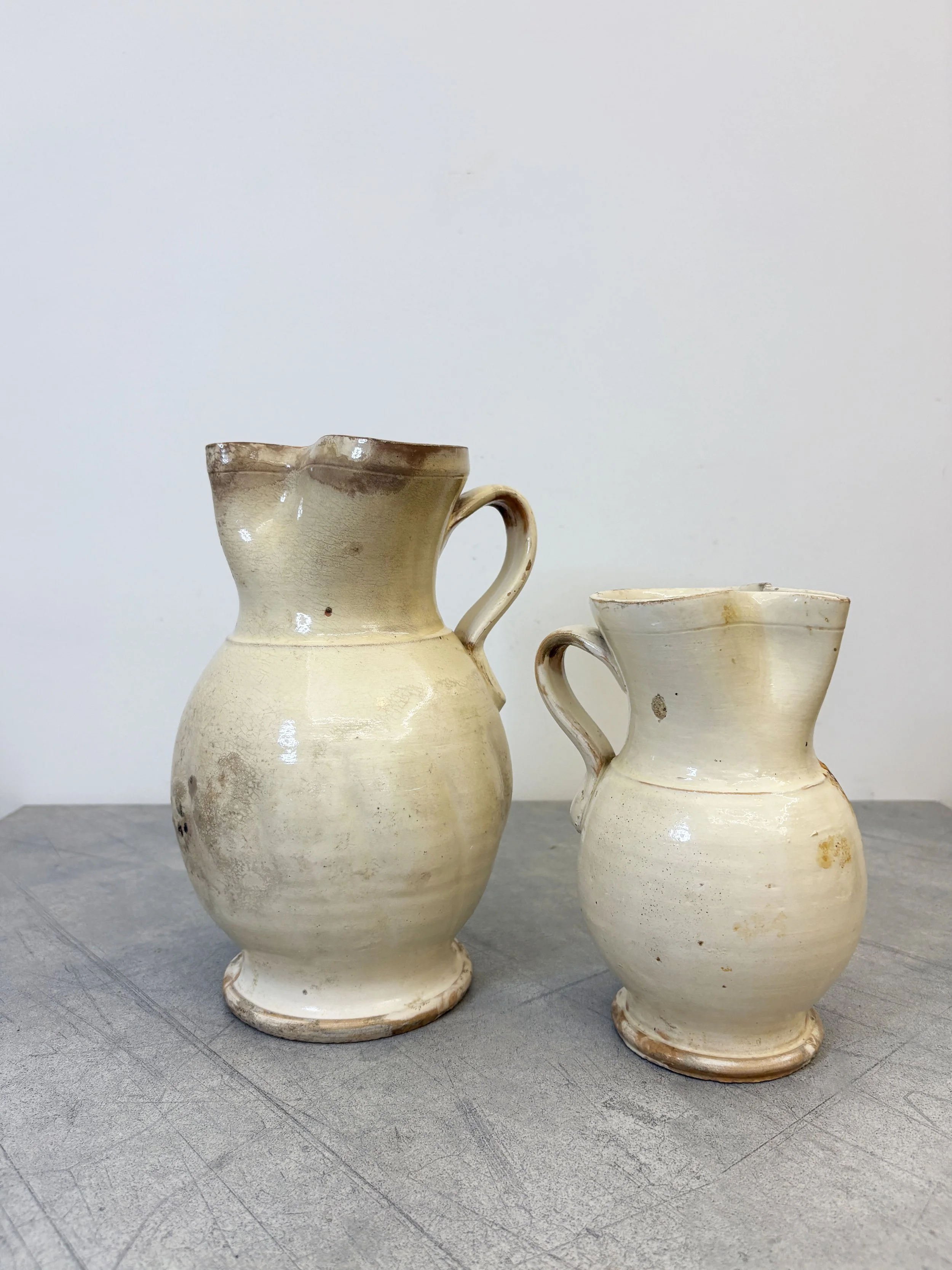 antique Italian cream glazed ceramic jugs