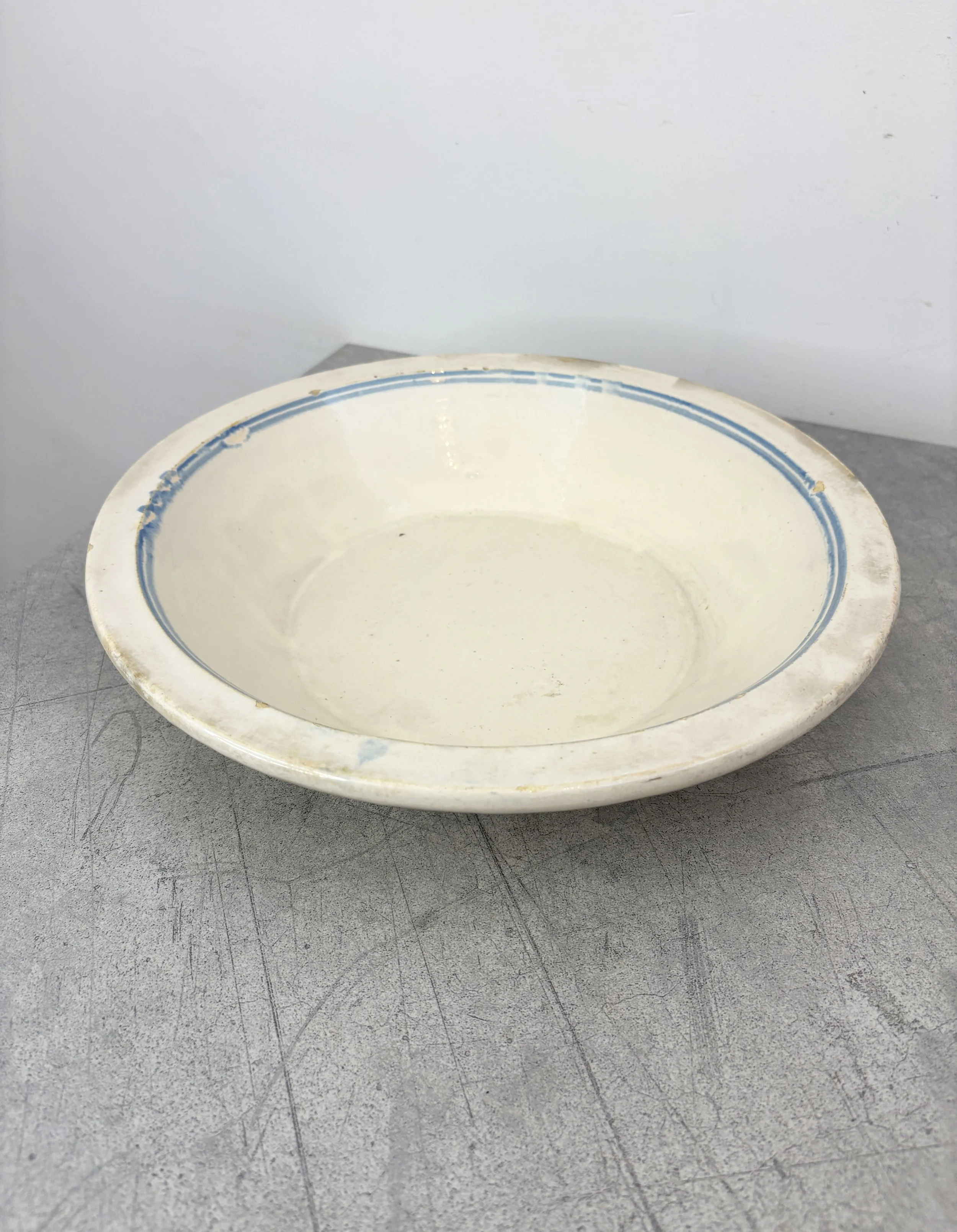 antique white and blue ceramic bowl
