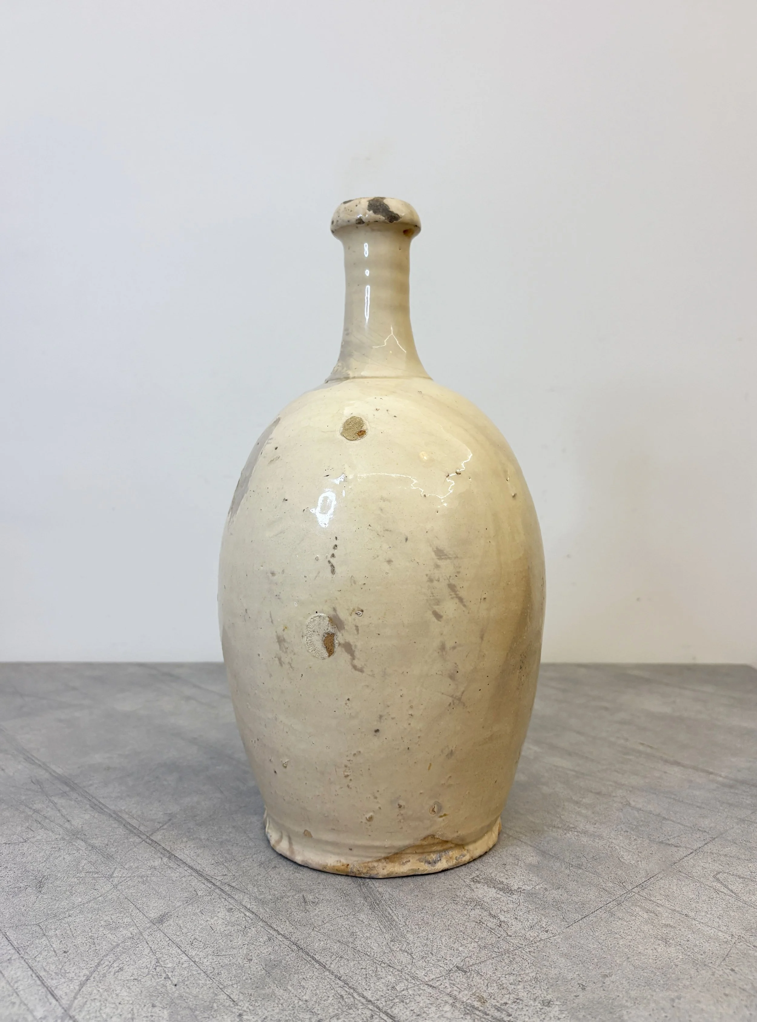 antique white ceramic wine bottle Puglia
