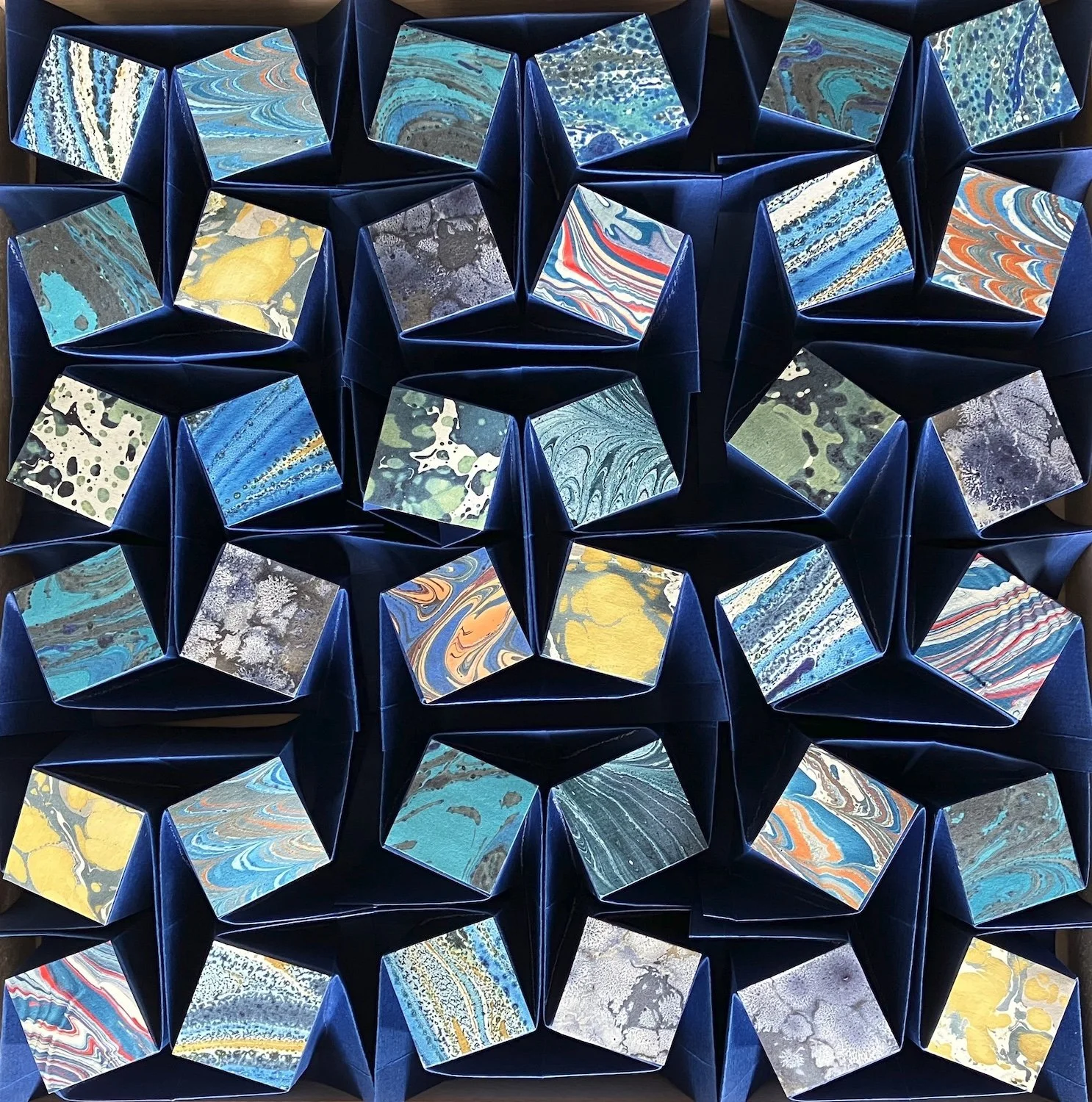 Sabine Thornau "FOLDED STRUCTURES", folded paper, marbled papers, wooden frame, 30 x 30 x 5cm, 2025, €480