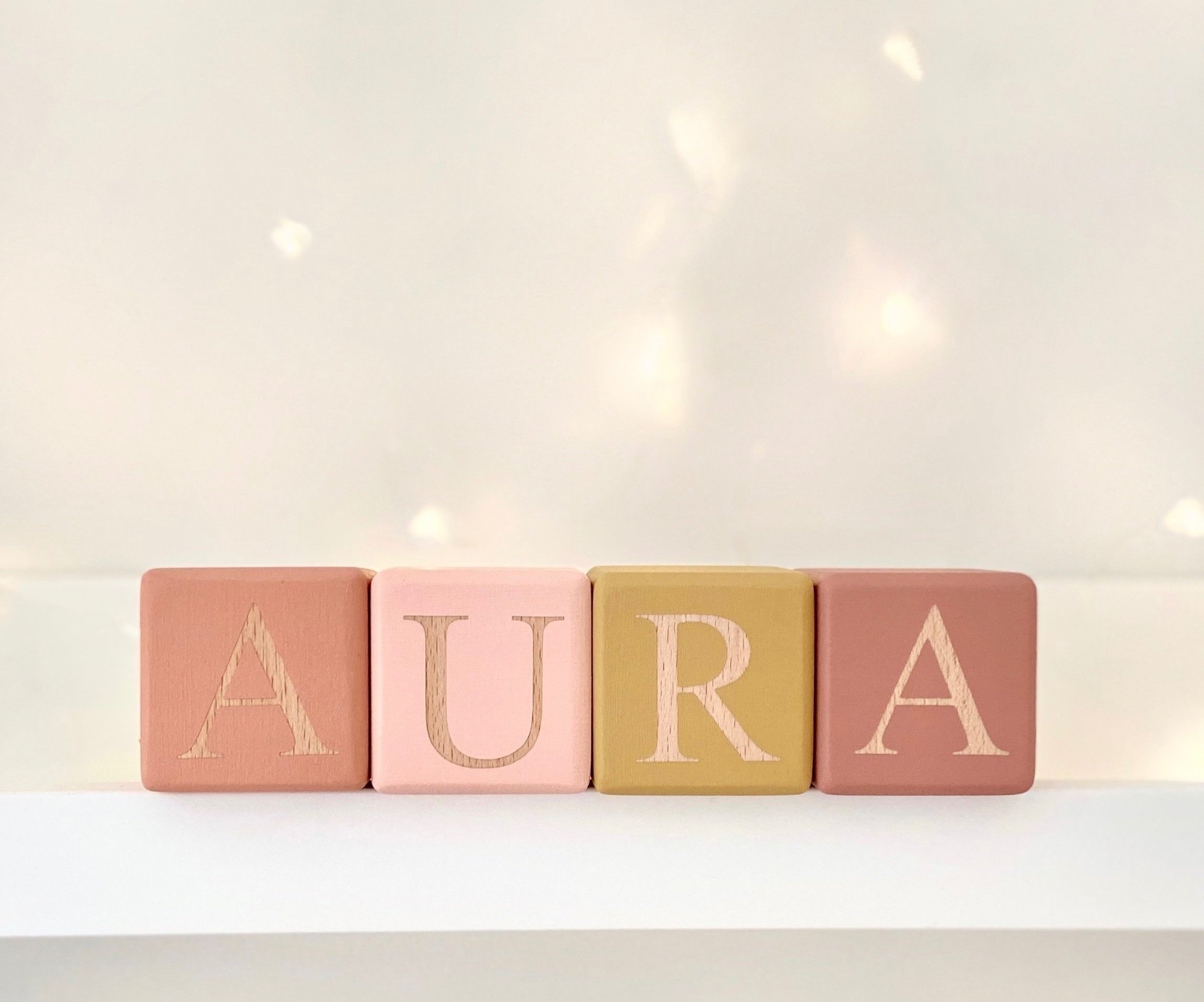  Aura’s blocks in original font with colourway featuring Starfish, Bare, Honeycomb and Terracotta 