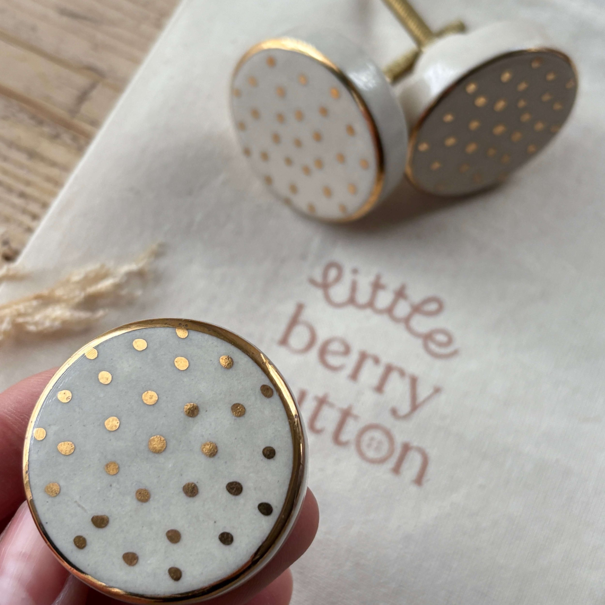 Gold ceramic drawer knobs with hand painted gold edge