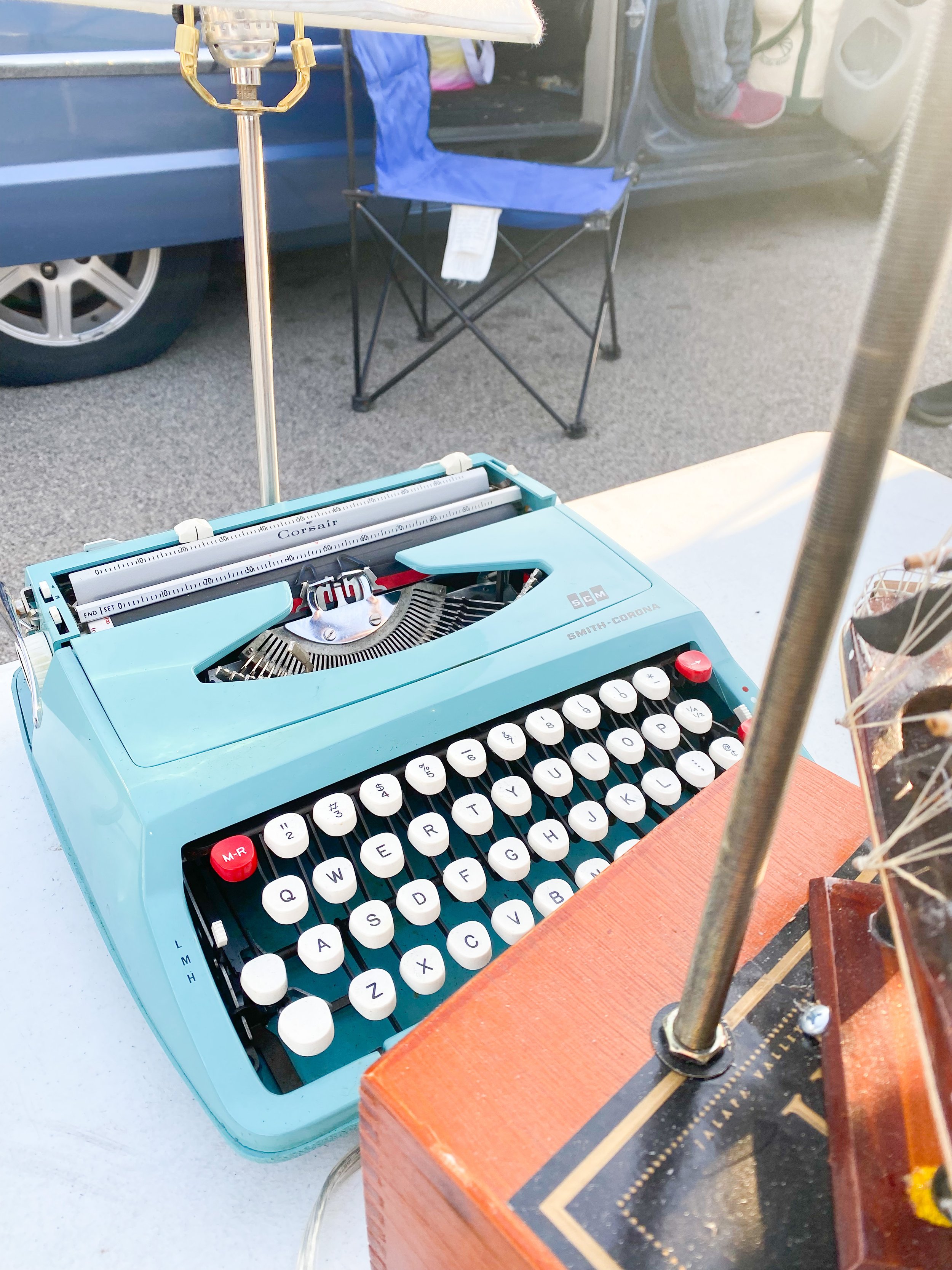 Vintage blue typewriter at a flea market