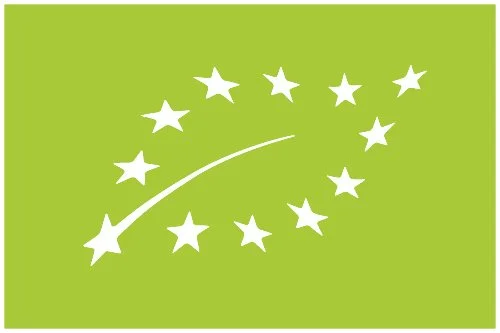 Grön bakgrund med vita stjärnor forming en båge, liknande EU-kommissionens symbol.