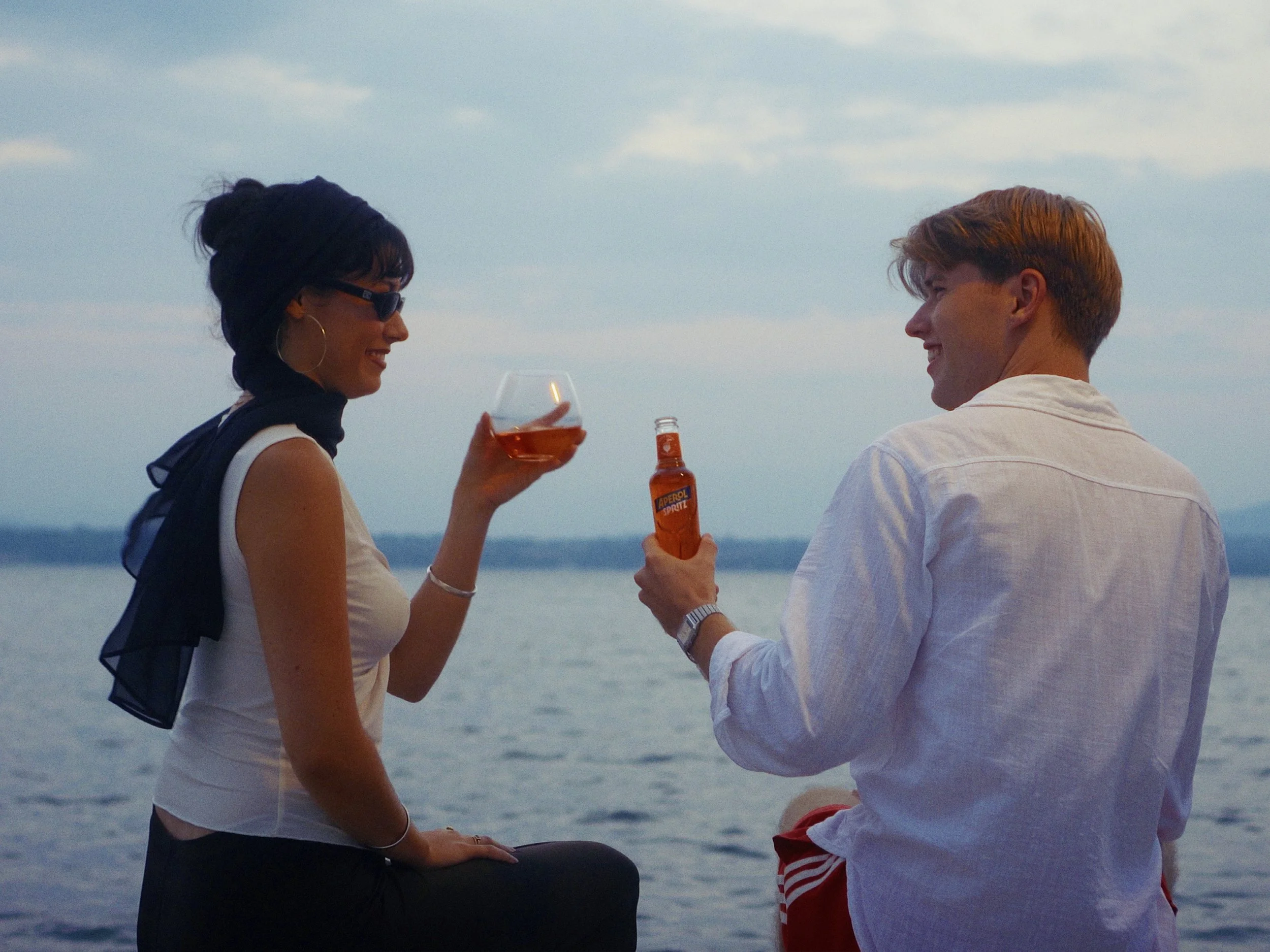 As my sister continues her journey within marketing, her next project centers around the romantic cinematic approach of the 70’s. A lonely woman by the sea, romanced by a bold stranger for a glass of Aperol. A drink neither of them can pronounce prop