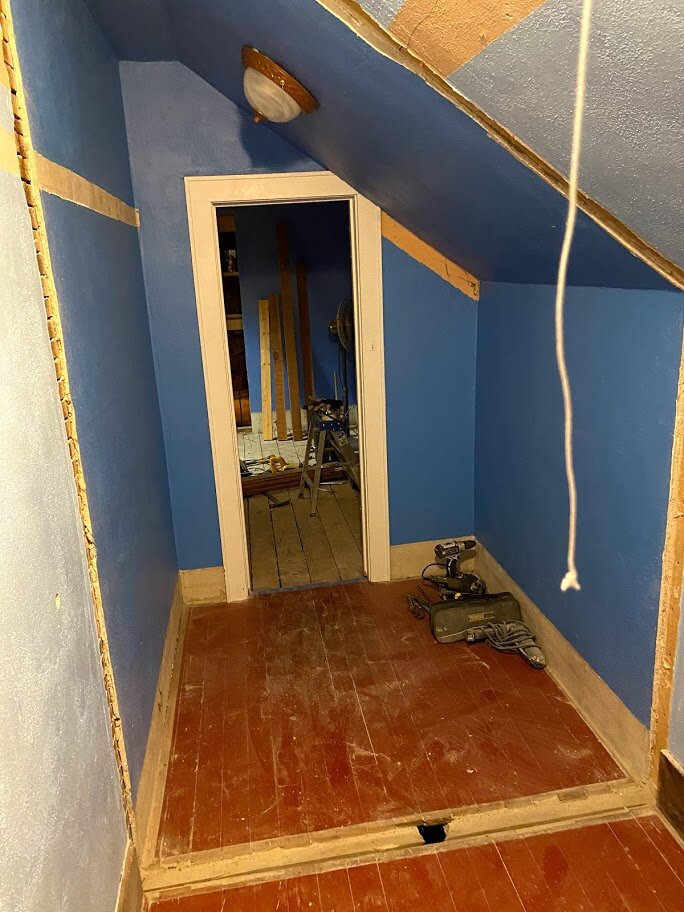 The dividing wall between two closets was removed to create a walk-through closet between the primary bedroom and the bathroom.