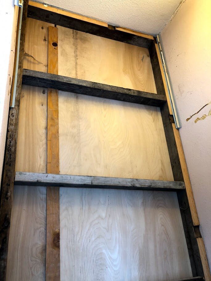 My brother, Steve, and I were left unsupervised on a Sunday and pulled all the paneling off of the stairway walls. The backside of a closet was revealed to be a modification to the original staircase.
