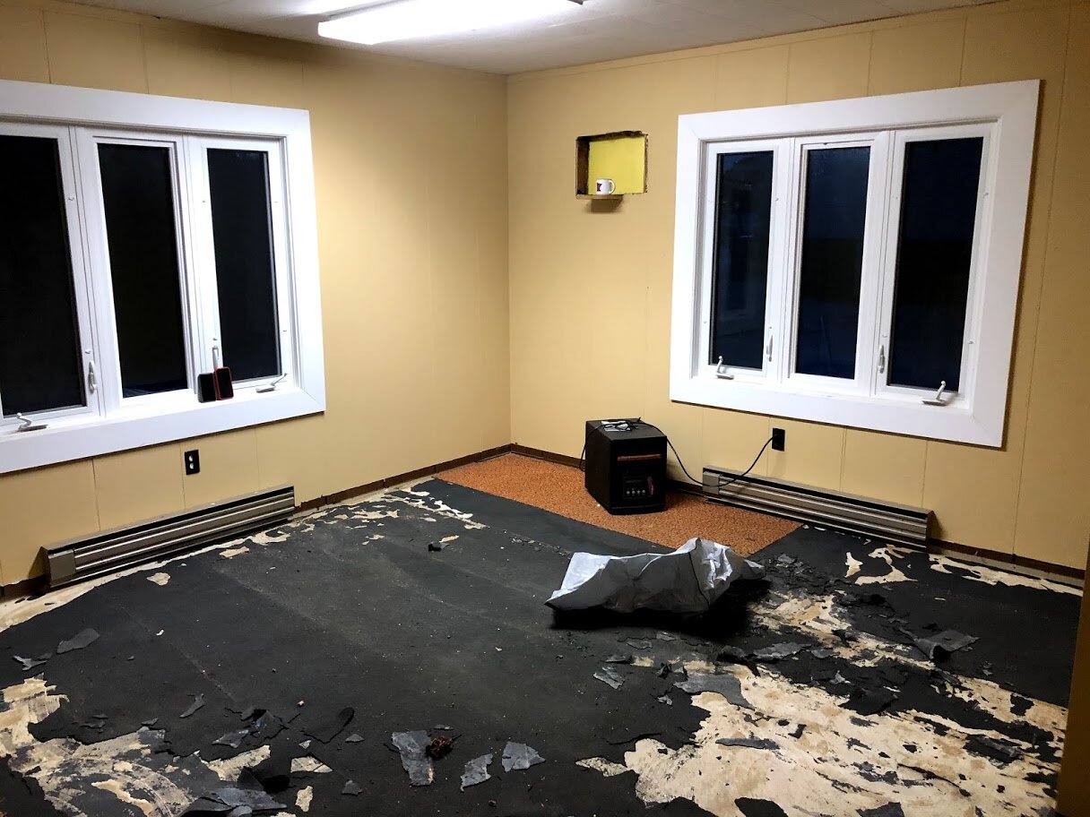 Removal of glued down carpet.