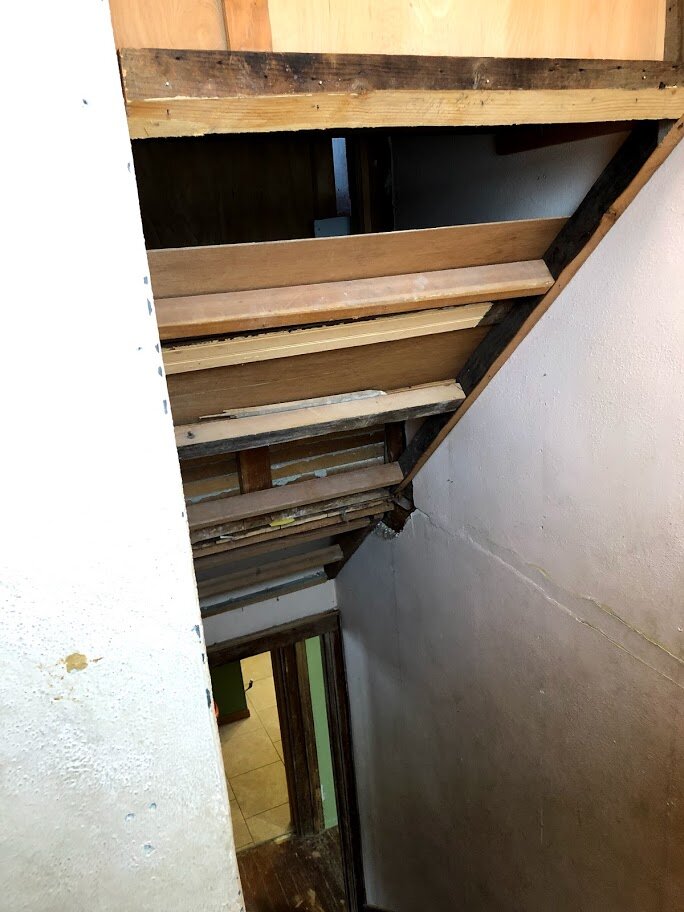 The angle added to the stairway to make room for the closet. We removed it.