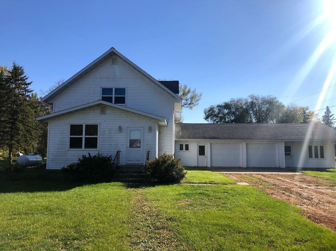 With the help of my Mom and brother-in-law, I removed the overgrowth and saplings.. Even though the siding will be replaced next summer, we did wash the front of the house in the fall.