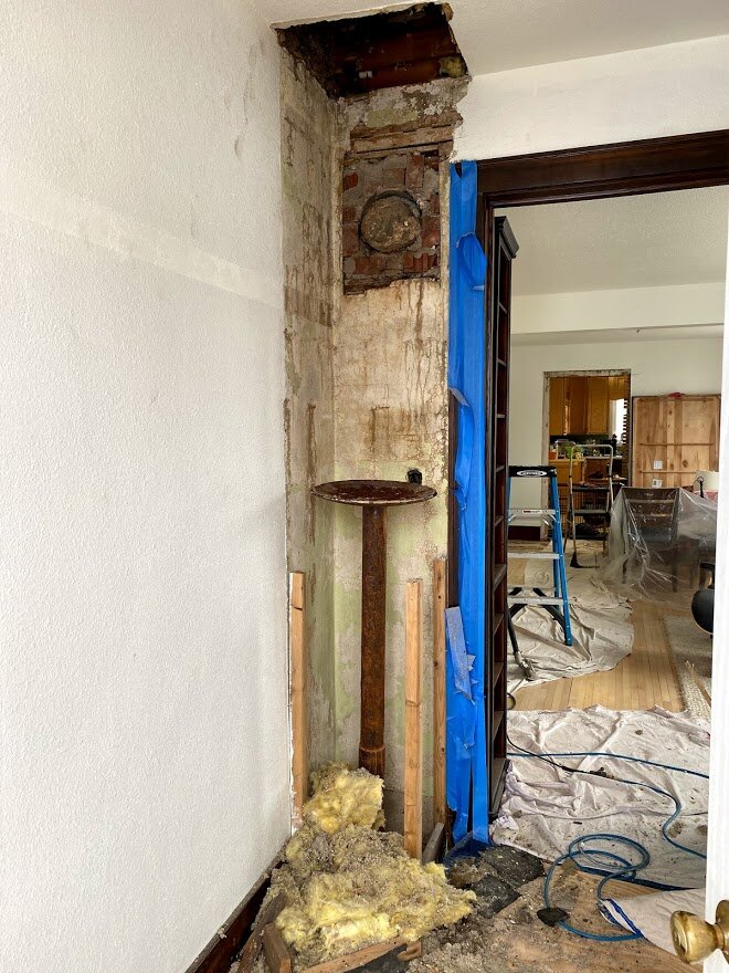 The blocks were held by a disc from a farm implement and a pipe that had filled with water. A stone was plugging the hole in the wall.