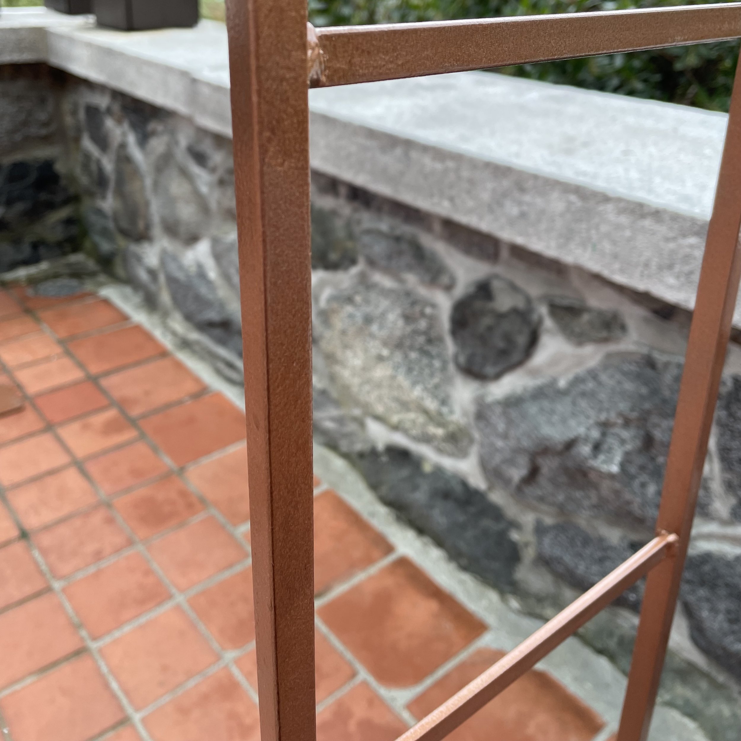 Close-up of copper garden arch.