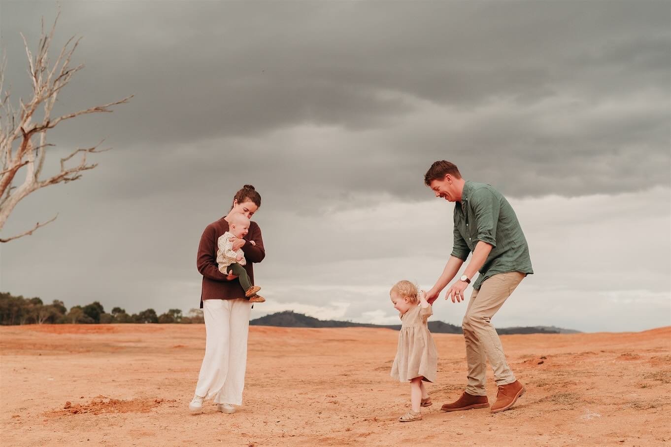 A stormy day getting caught in the rain which can only be described as complete perfection. A glorious stormy sky, a dried up lake and the warmth of their love. Capturing the beauty of raising their two golden girls. The most remarkable of evenings w