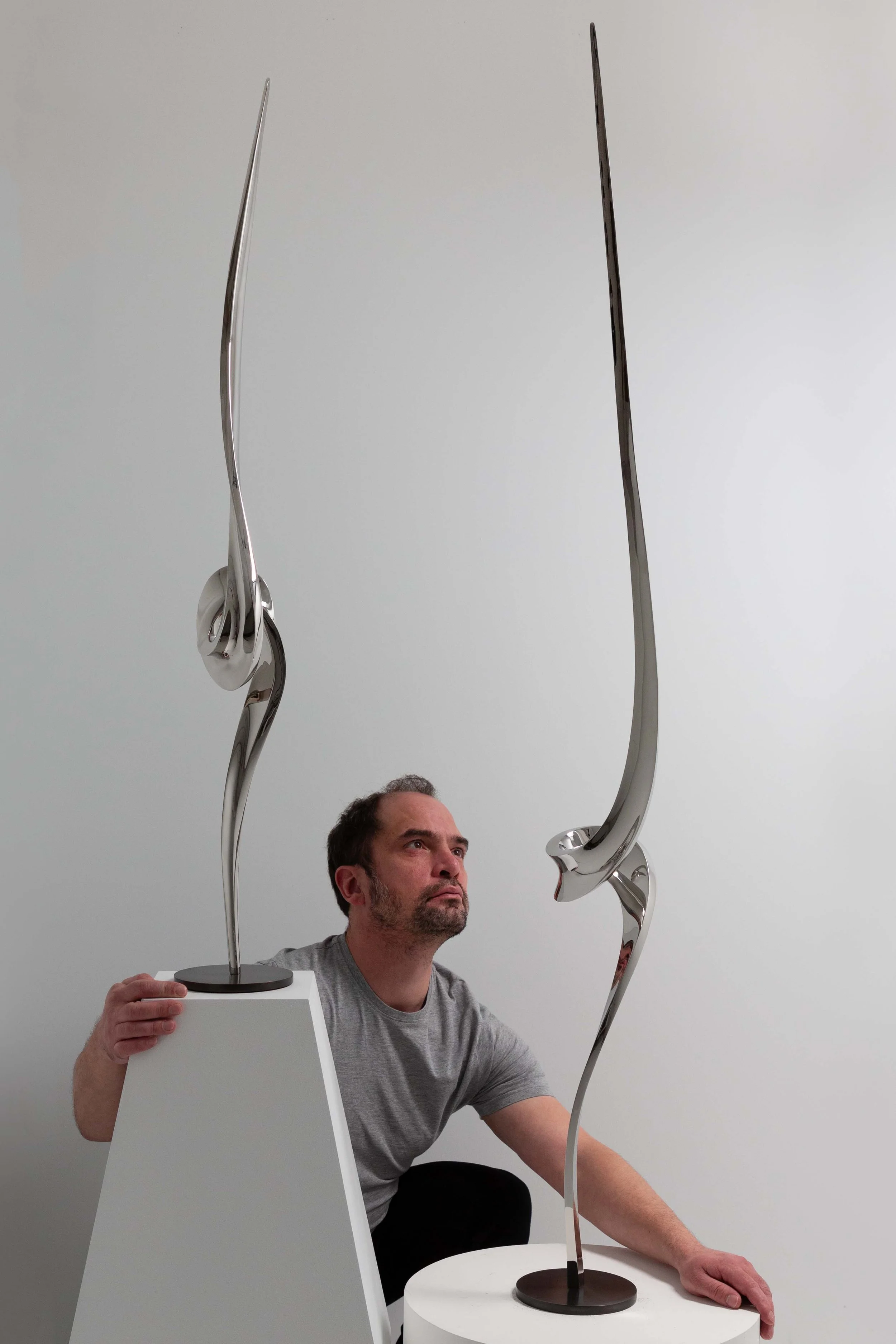 Hugh Chapman British artist and sculptor with his stainless steel sculptures. Showing the self taught artist in his west Sussex studio where he makes bronze and stainless steel sculpture inspired by spirituality and the beauty of the natural world