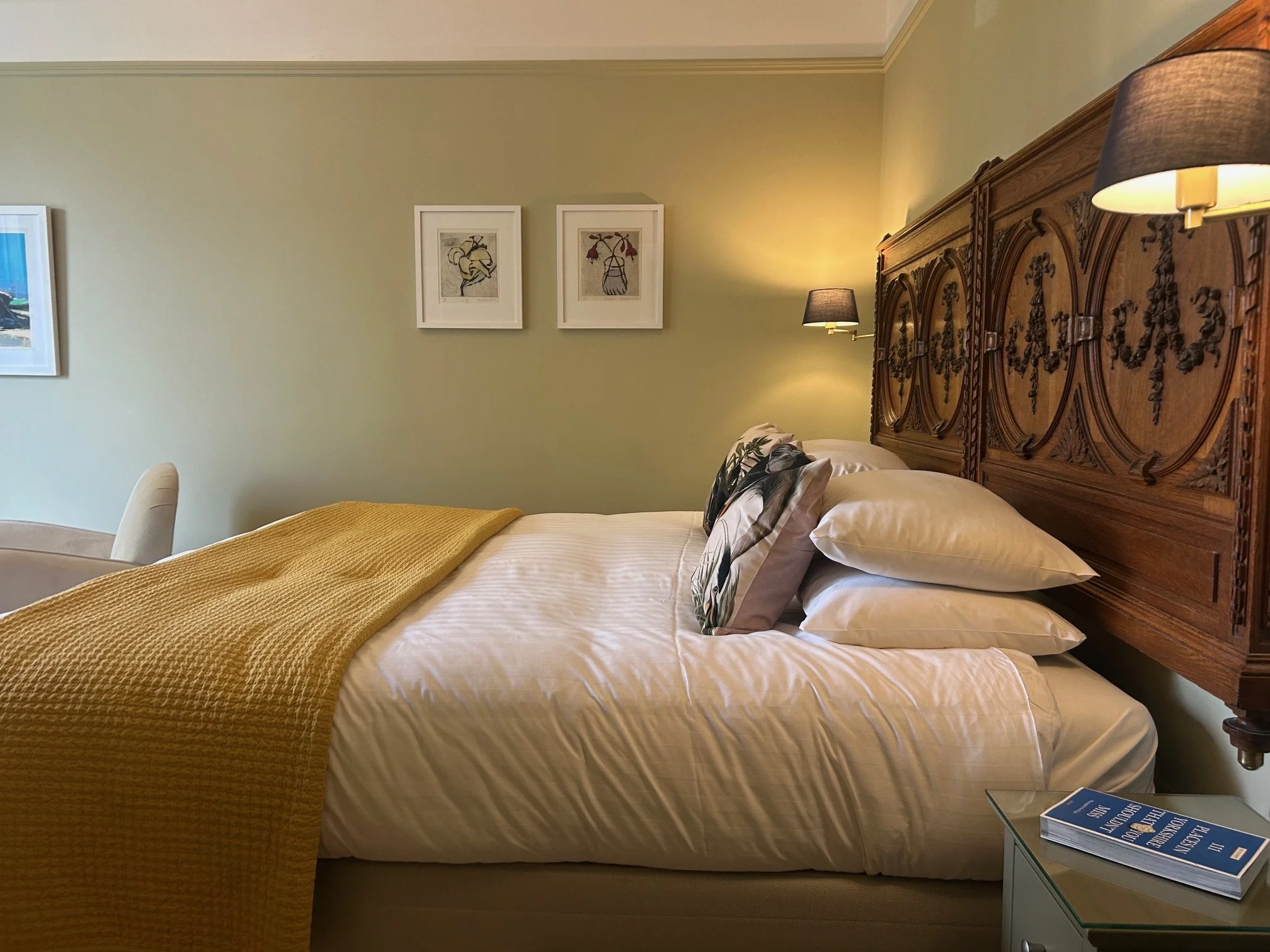 A side profile of the bed with Richard Spare artwork on the wall