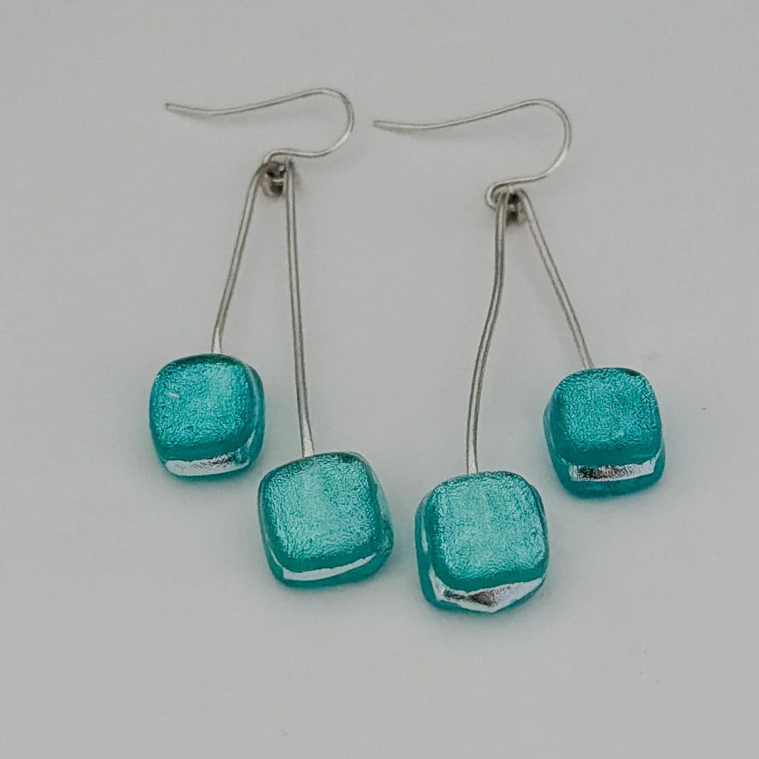silver-tide-earrings-swing-1.jpg