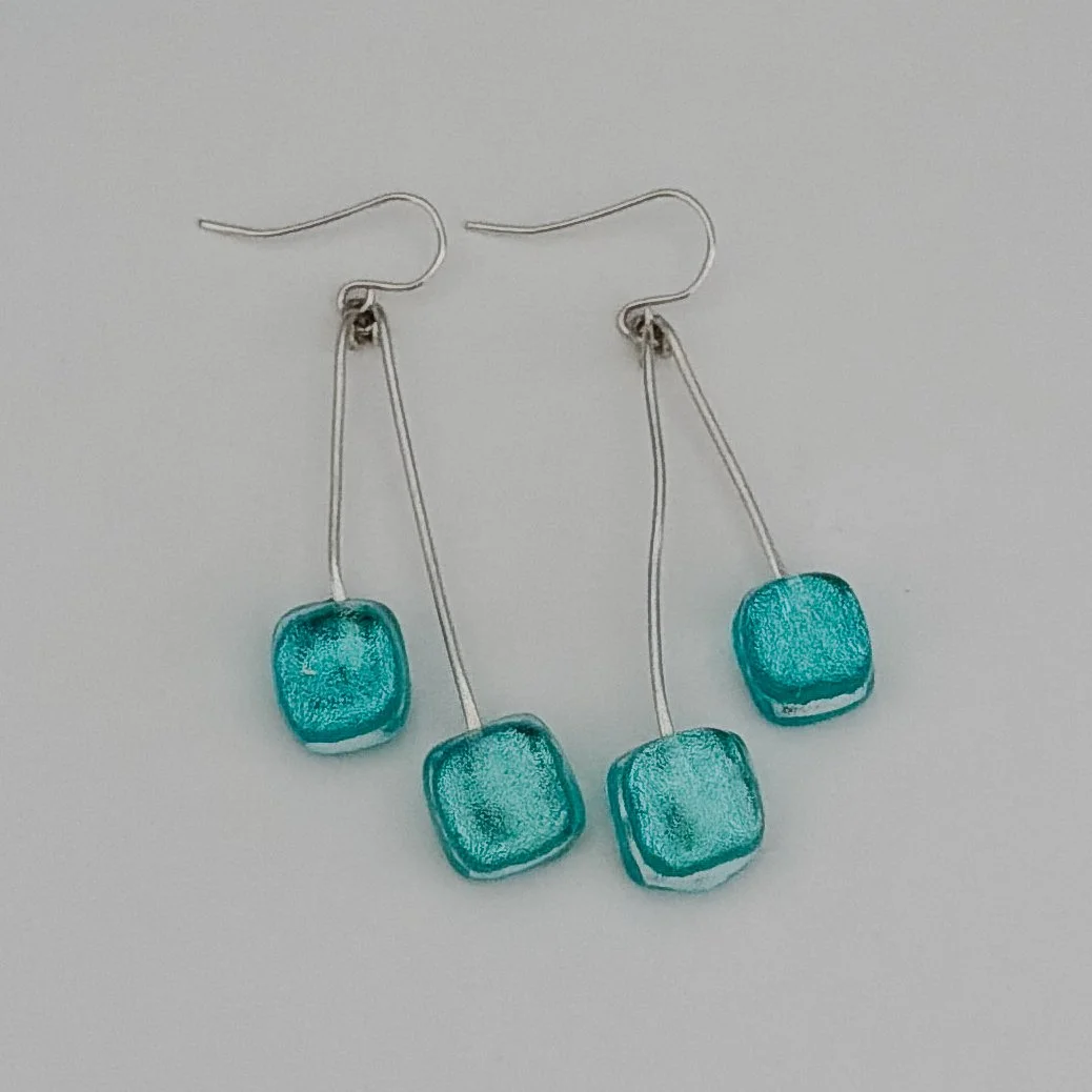 silver-tide-earrings-swing.jpg