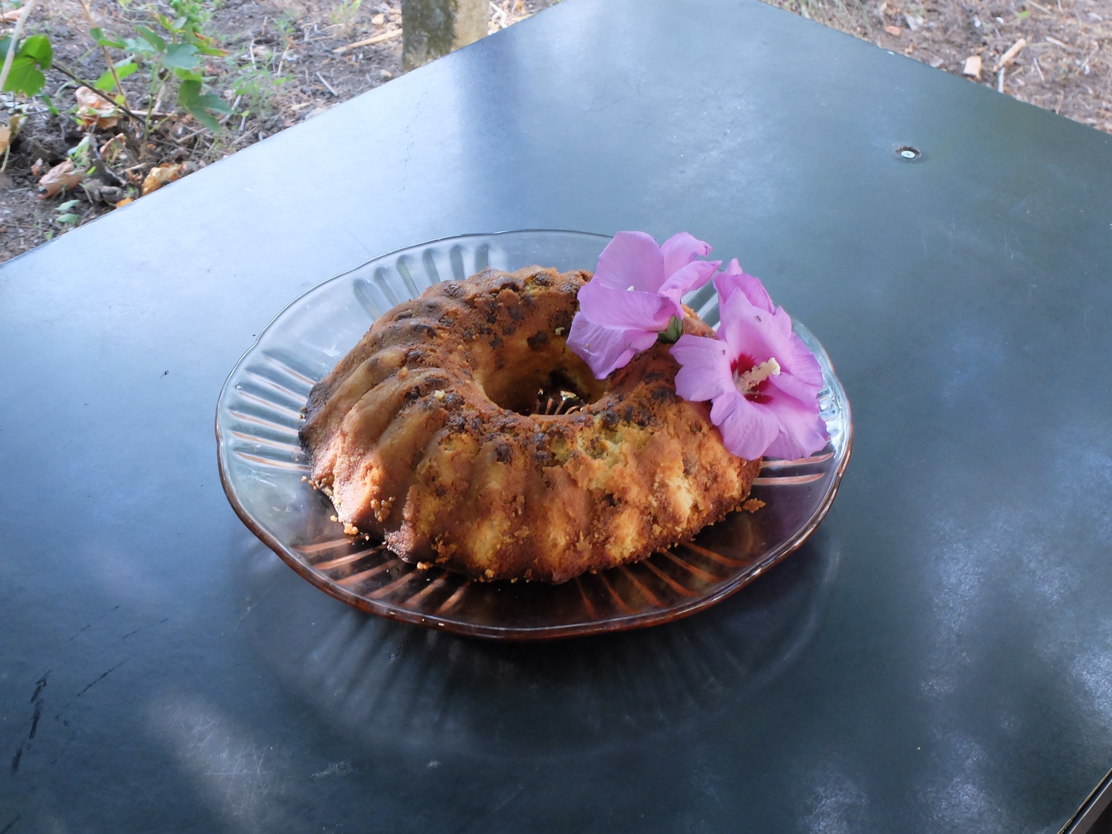   Takeshi Yoshida, Recipe: Quark cake with no base, glass plate from baba Vasa's kitchen, purple hibiscus flowers from the bush at Maritza Street 22, Shabla, cooked by Laurenz  