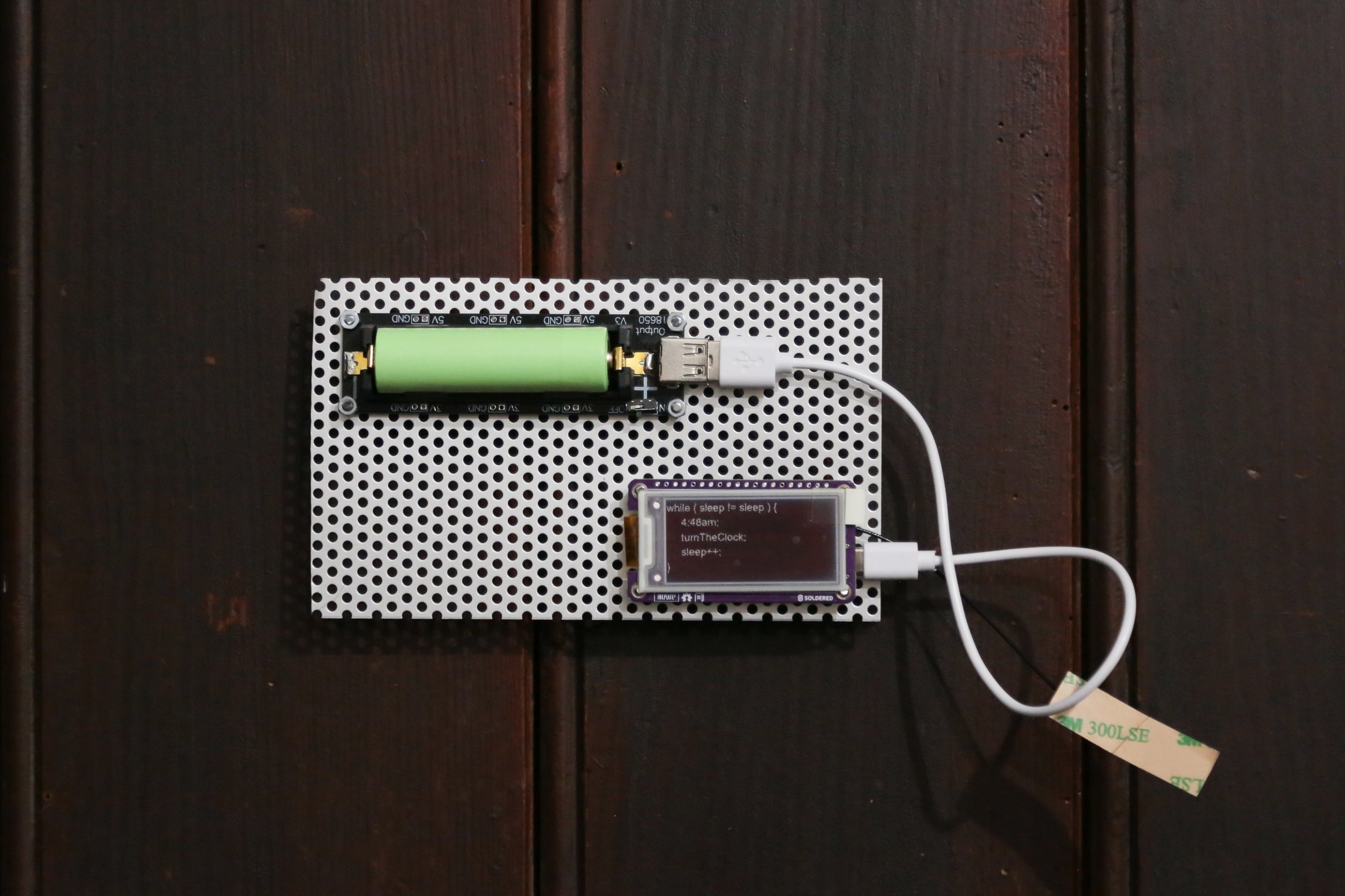   fig12  Gianna Virginia Prein,  4:48 , 2025, Code Poems on Inkplate with ESP32 microcontroller, lithium battery, USB-cable, aluminium sheet, 23 × 16 × 6 cm 