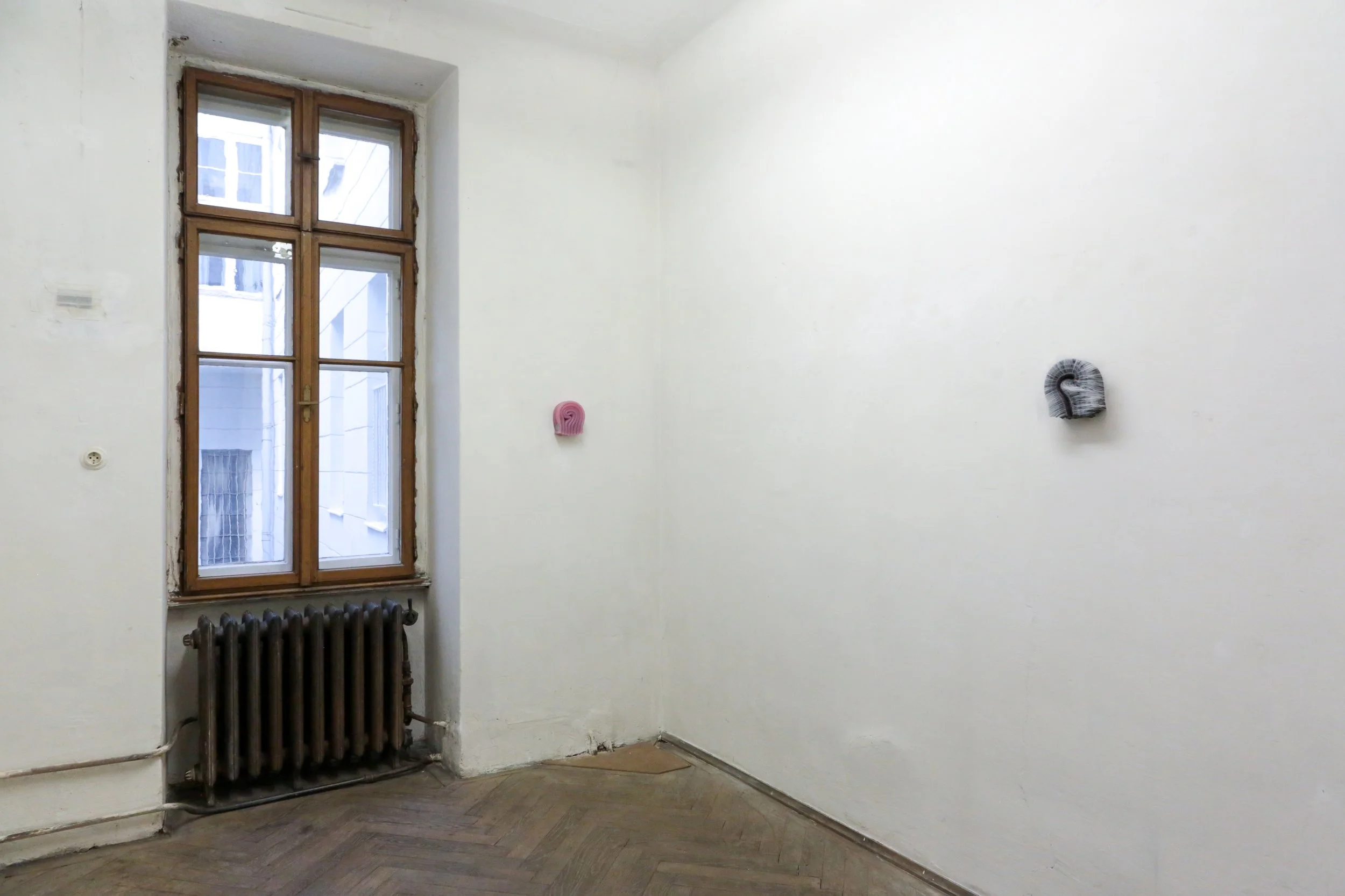 fig22  installation view, Mike Kelley & Marlie Mul, Laurenz & Shimmer, Vienna; Marlie Mul,  Unnamed Charm , 2024, Silicone, stainless steel hardware, Unique. 5 x 6 x 2.4 inches; Marlie Mul,  Unnamed Charm , 2024, Silicone, pin with glass, h
