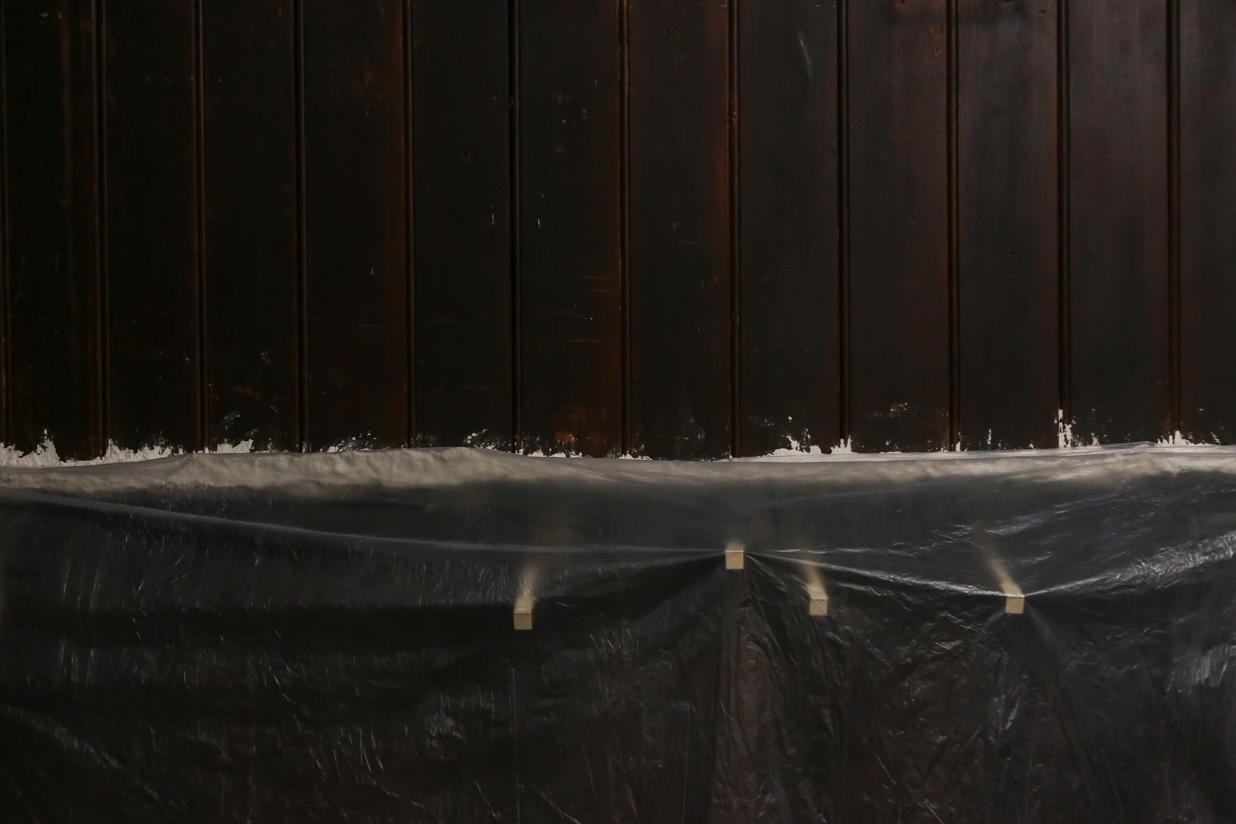   fig2  installation view, Ian Waelder,  accompaniment , 2025, paper mache, new and used piano keys, plastic film, air-dry porcelain, prints on paper, tape, switched-on light bulbs, site specific dimension 