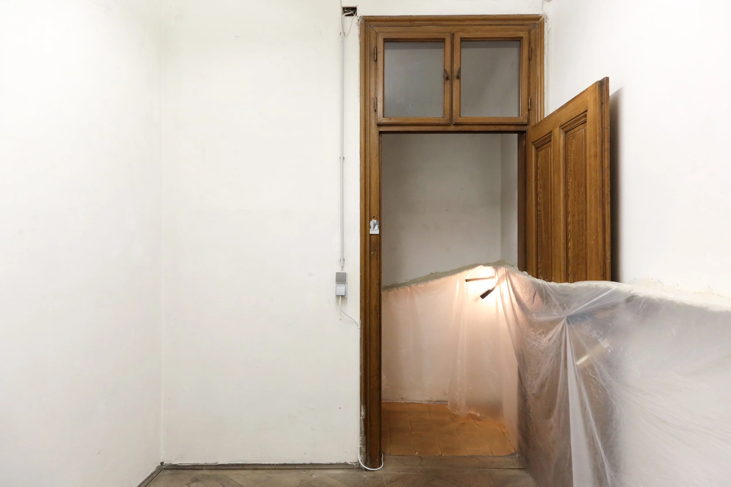   fig22  installation view, Ian Waelder,  accompaniment , 2025, paper mache, new and used piano keys, plastic film, air-dry porcelain, prints on paper, tape, switched-on light bulbs, site specific dimension 