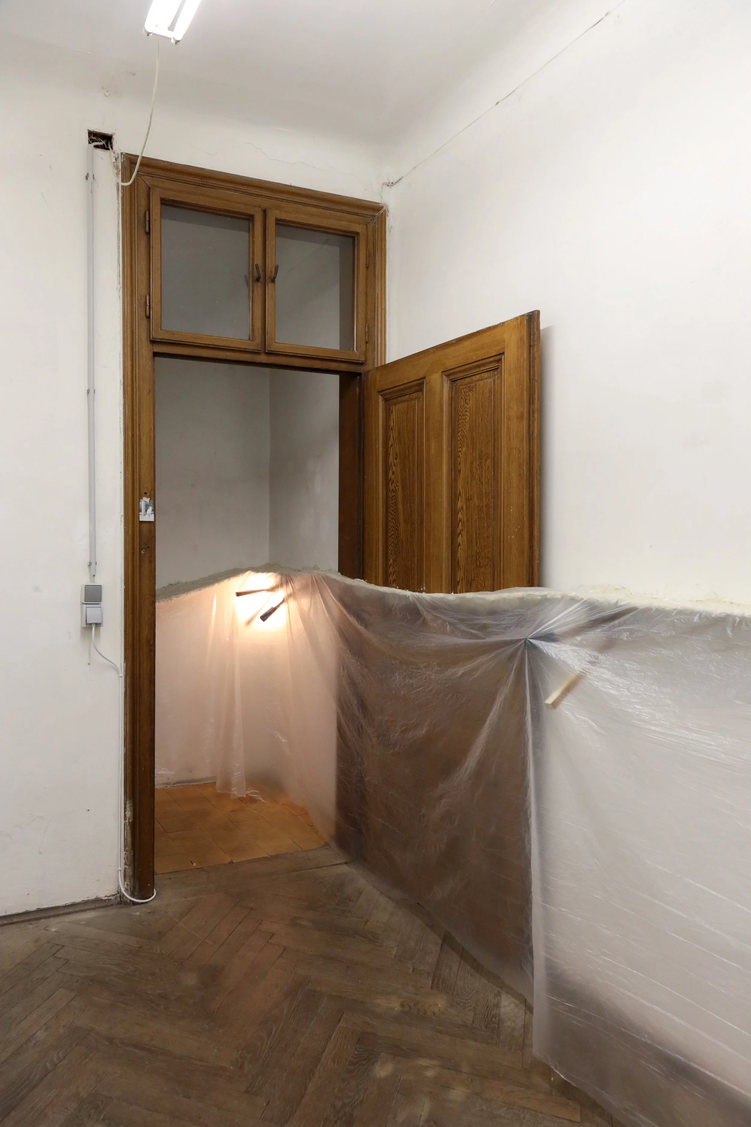   fig29  installation view, Ian Waelder,  accompaniment , 2025, paper mache, new and used piano keys, plastic film, air-dry porcelain, prints on paper, tape, switched-on light bulbs, site specific dimension 