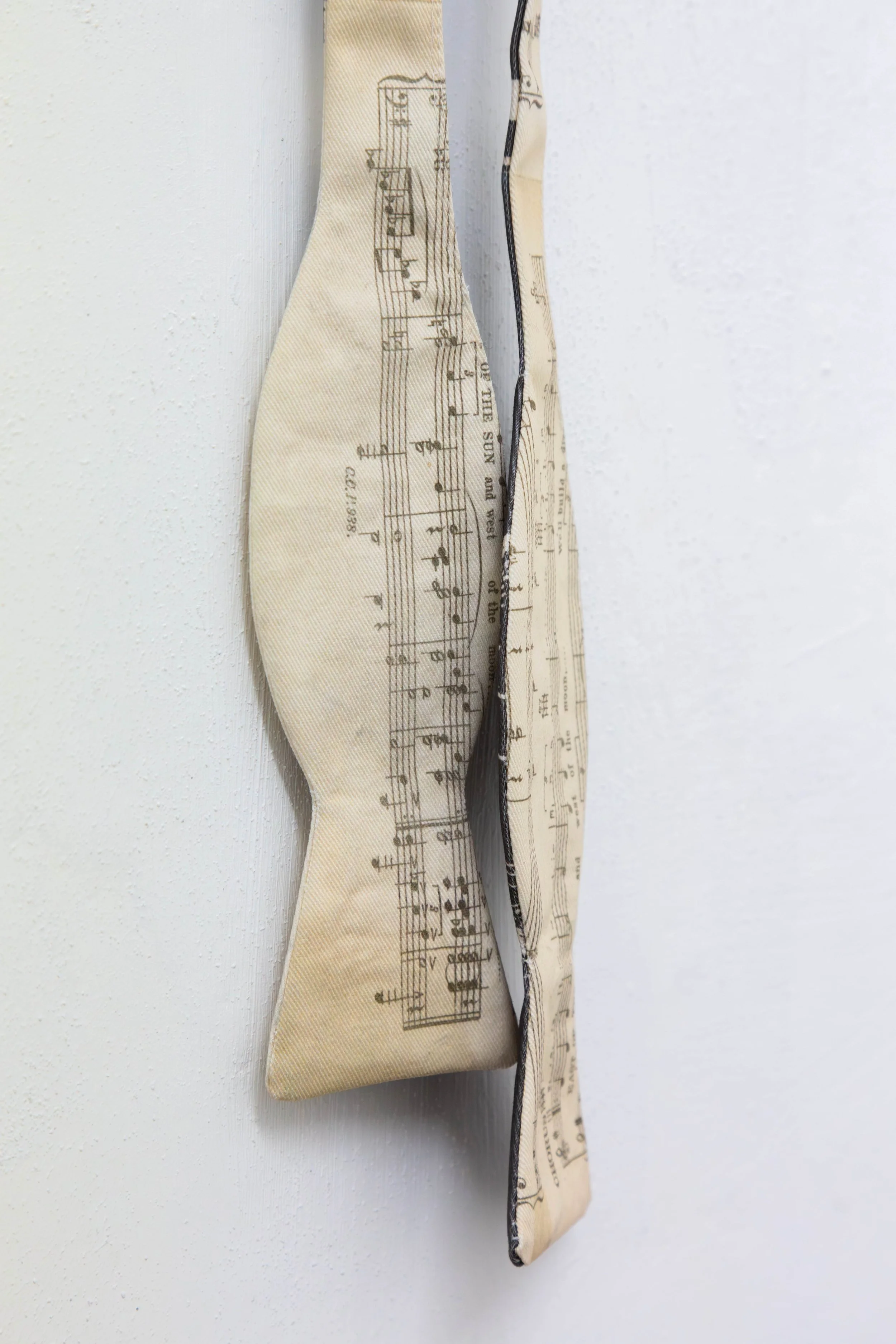   fig11  Persijn Broersen &amp; Margit Lukács, Smári Róbertson,  Bridle (overture, interlude, coda) , 2026. printed canvas bow ties/ printed satin bowties (worn), various dimensions 