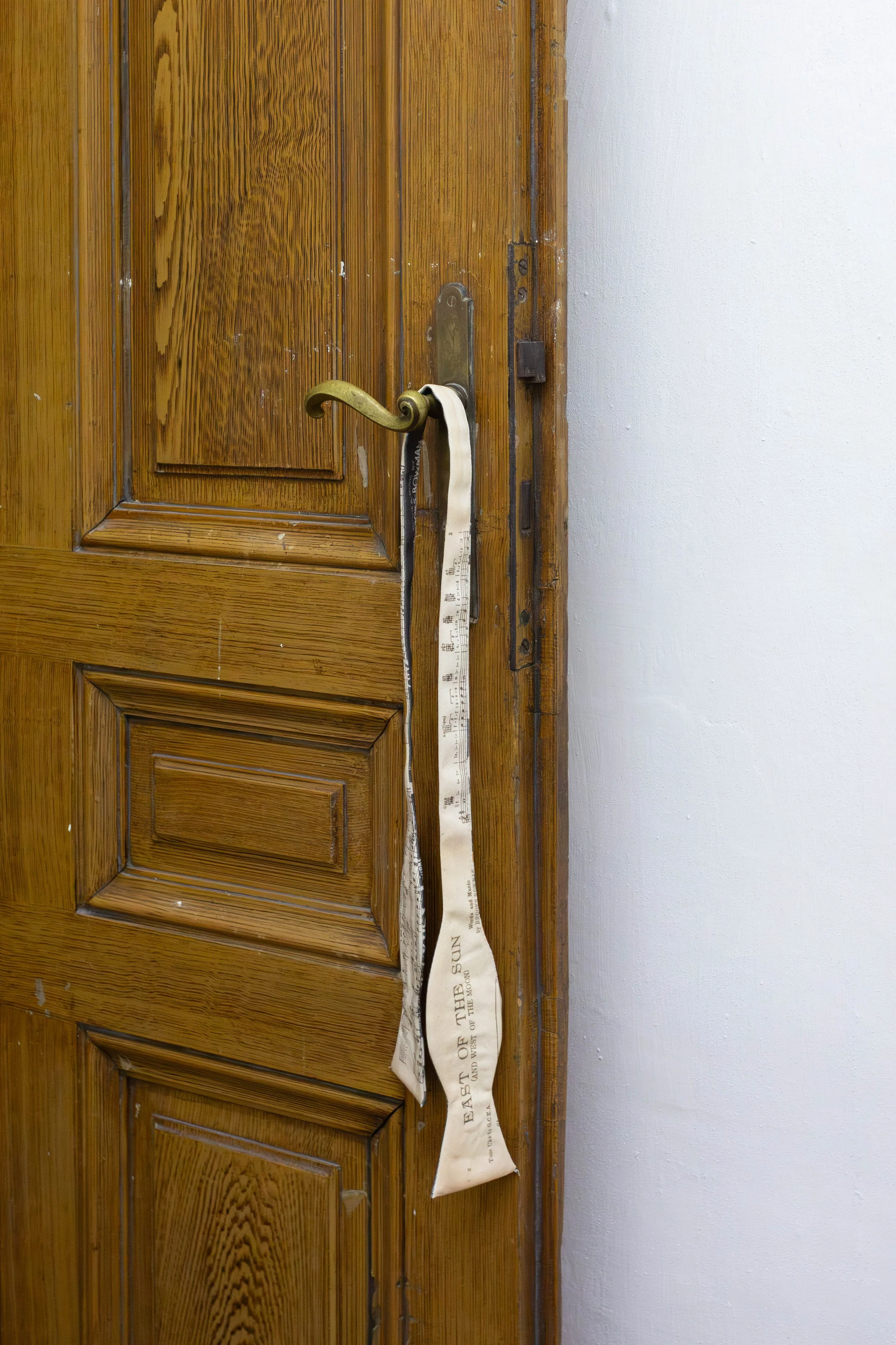   fig14  Persijn Broersen &amp; Margit Lukács, Smári Róbertson,  Bridle (overture, interlude, coda) , 2026. printed canvas bow ties/ printed satin bowties (worn), various dimensions 