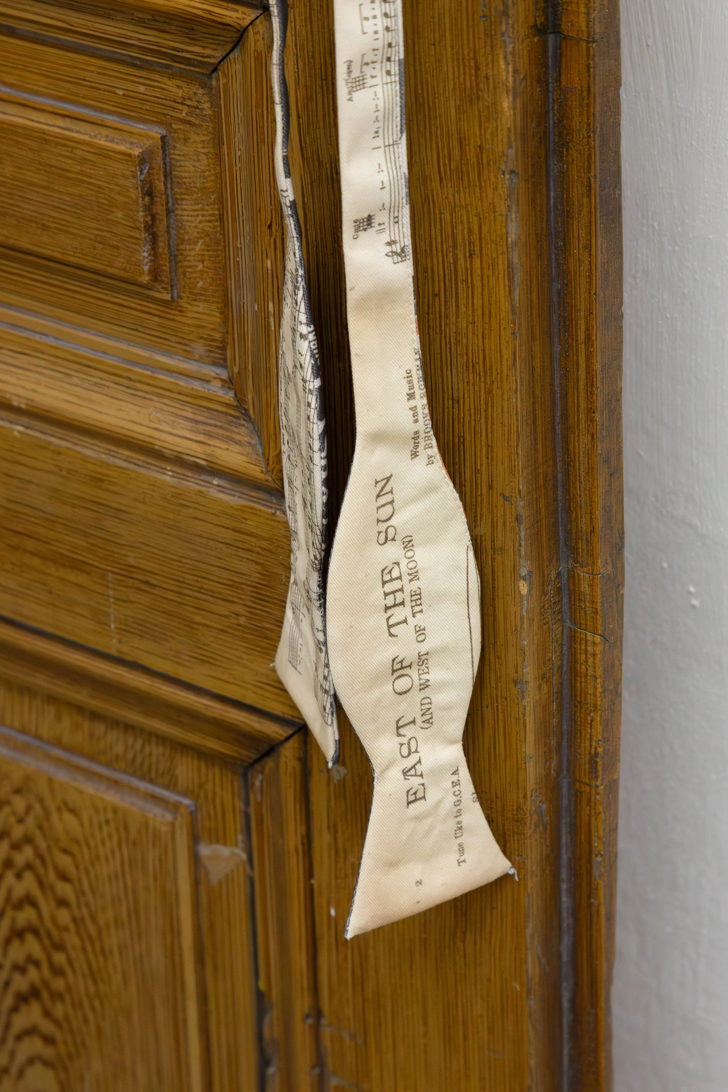   fig15  Persijn Broersen &amp; Margit Lukács, Smári Róbertson,  Bridle (overture, interlude, coda) , 2026. printed canvas bow ties/ printed satin bowties (worn), various dimensions 