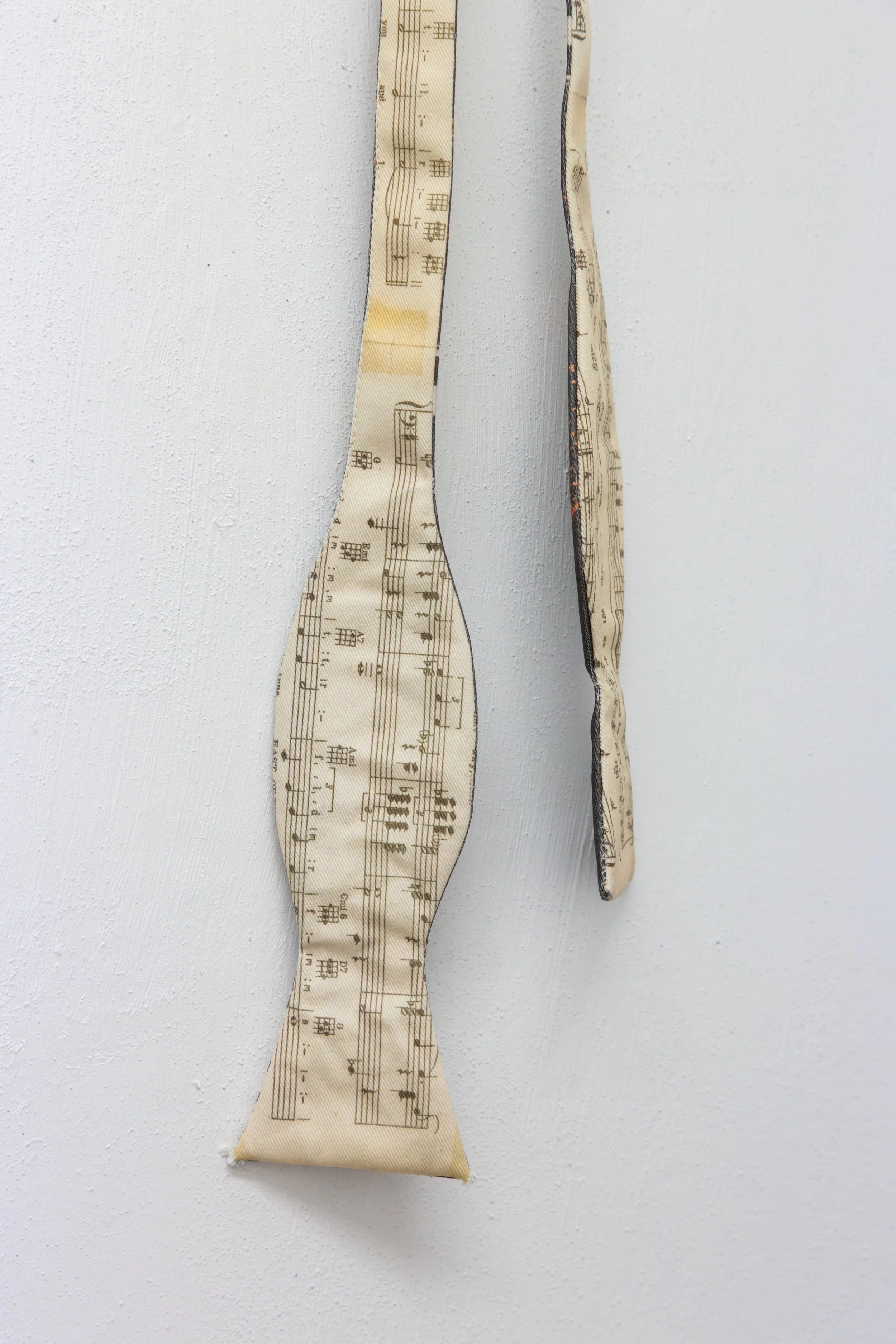   fig18  Persijn Broersen &amp; Margit Lukács, Smári Róbertson,  Bridle (overture, interlude, coda) , 2026. printed canvas bow ties/ printed satin bowties (worn), various dimensions 