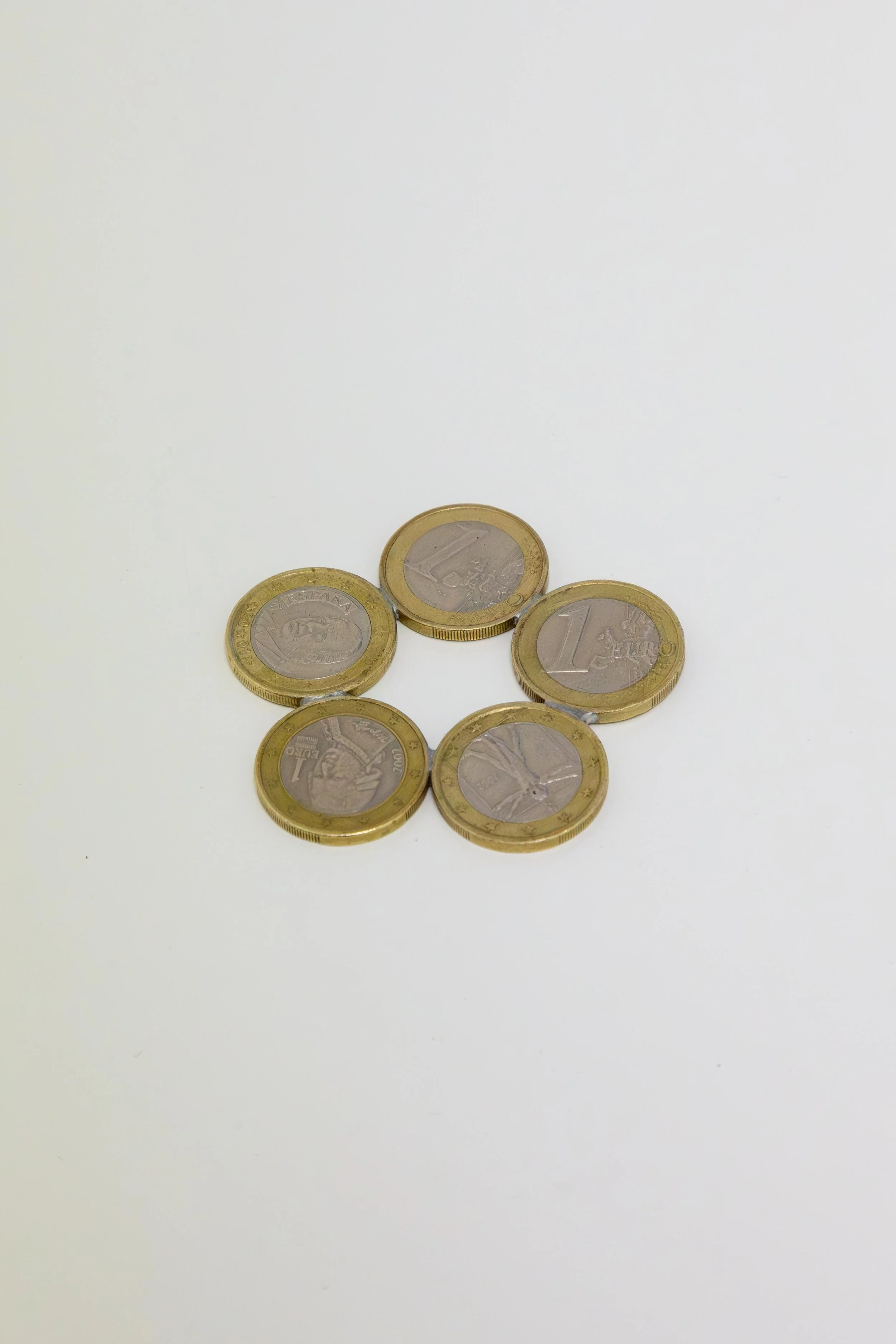   fig30  Lucia Elena Průša,  EURO , 2018–2026, Euro coins, tin solder, 6 × 6 cm 