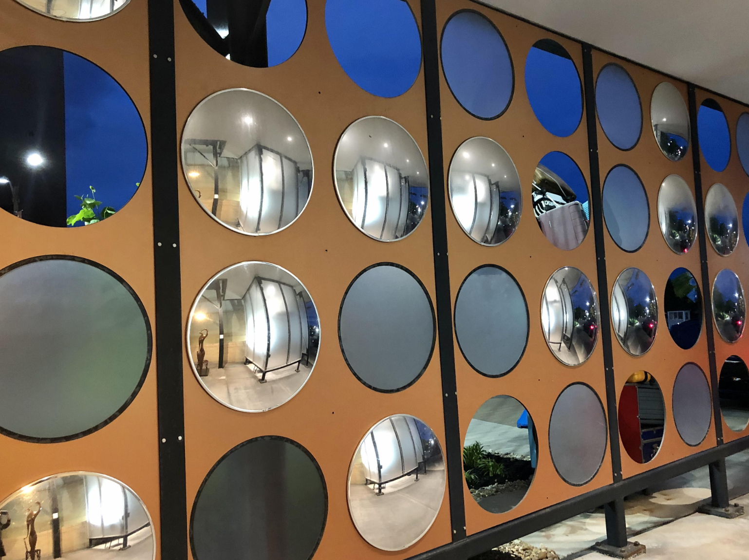 art deco wall with different colored circles and mirros