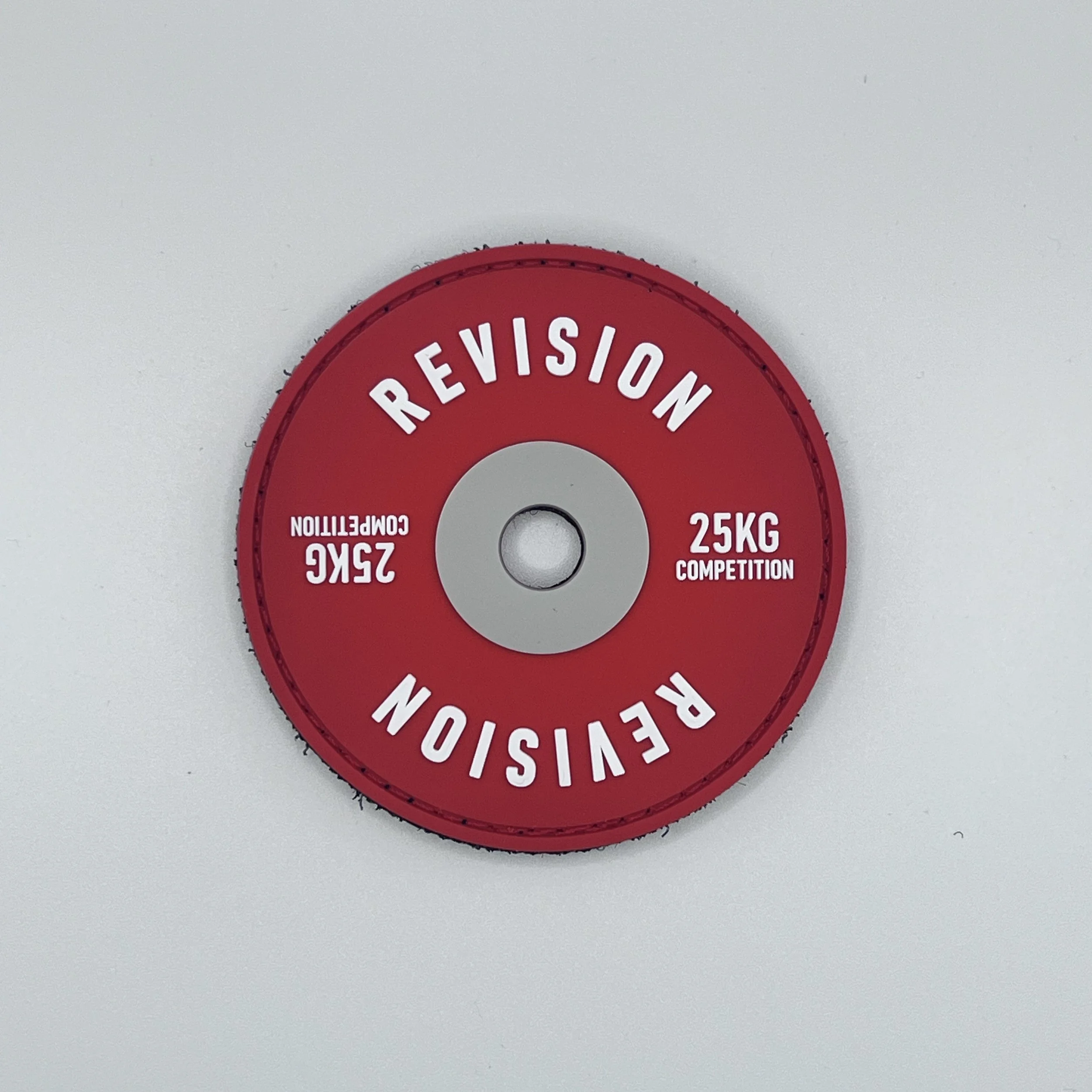 White magnesium carbonate chalk block resting next to gymnastics grips for Murph workout