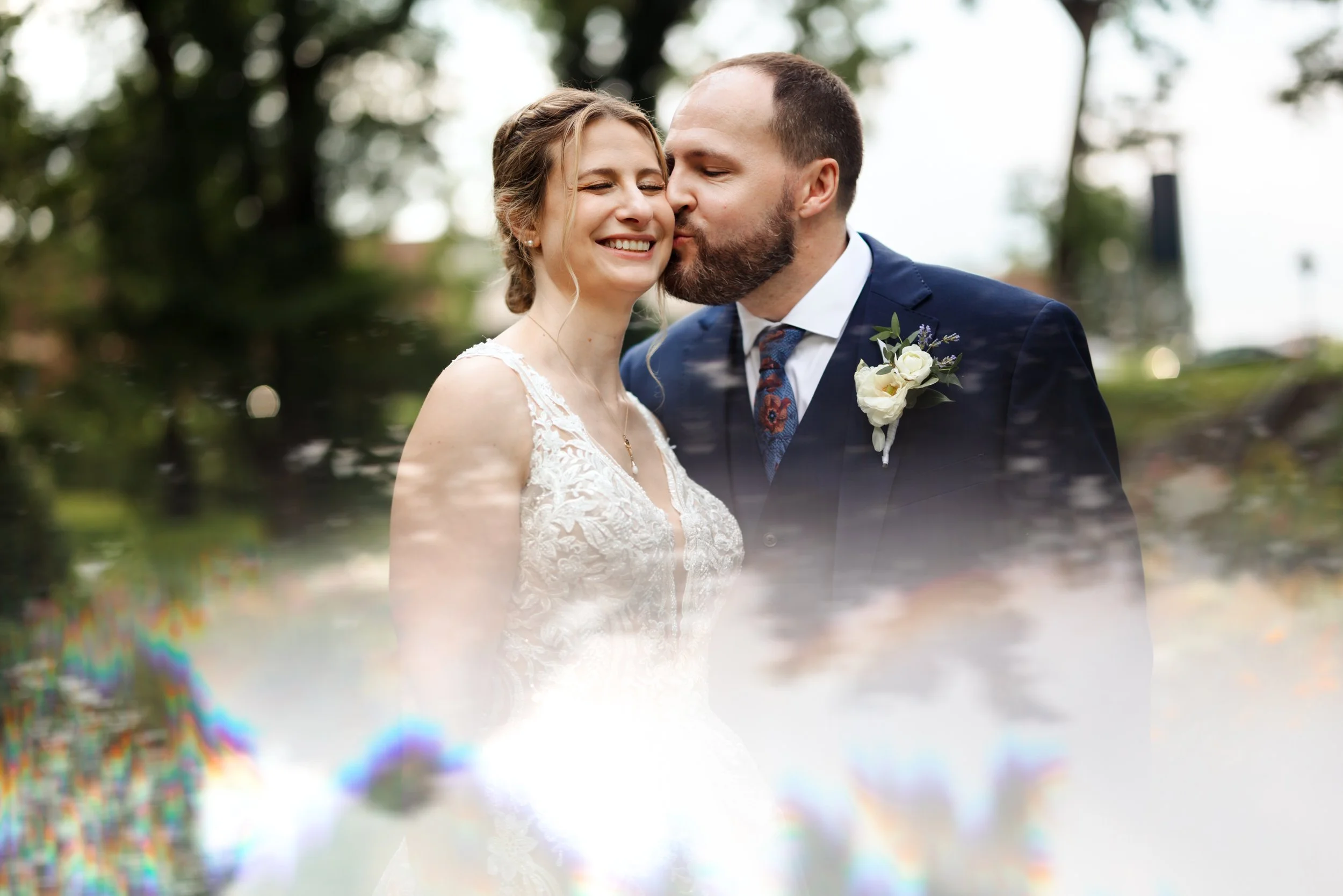 Candid moment of a bride and groom during a 20-guest micro wedding ceremony in a historic Reading, Pennsylvania, courtyard.