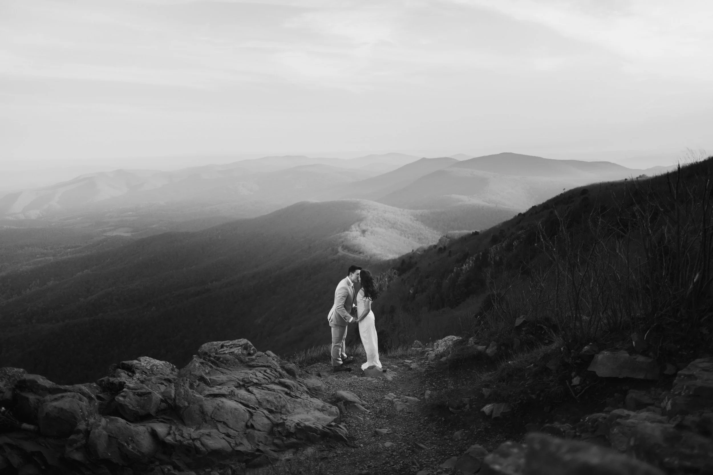 Adventurous elopement photographer for Southeastern PA couples; romantic mountain top ceremony with panoramic views at sunrise.