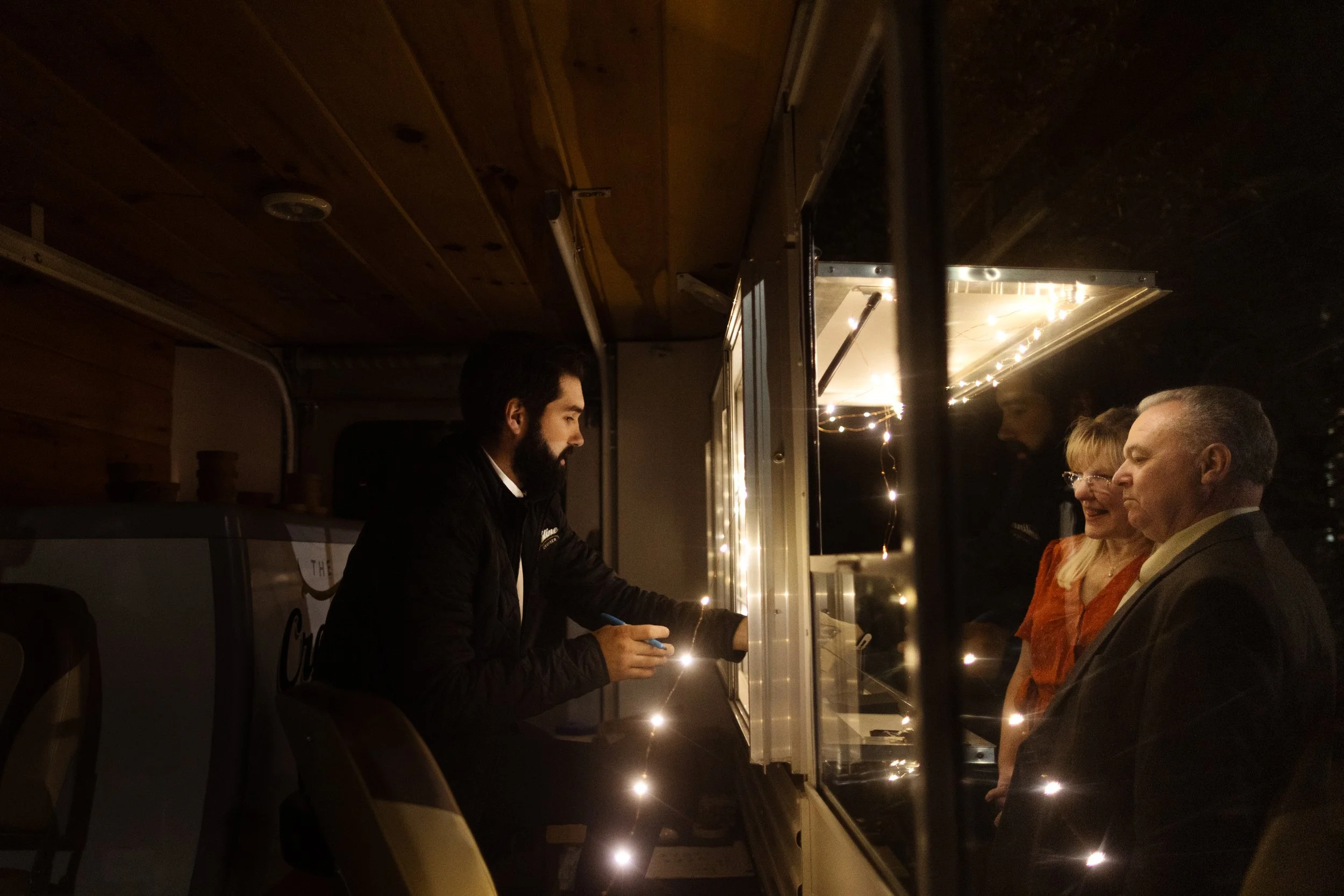 Wedding guests ordering from a local food truck at an intimate outdoor wedding reception in Reading, PA.