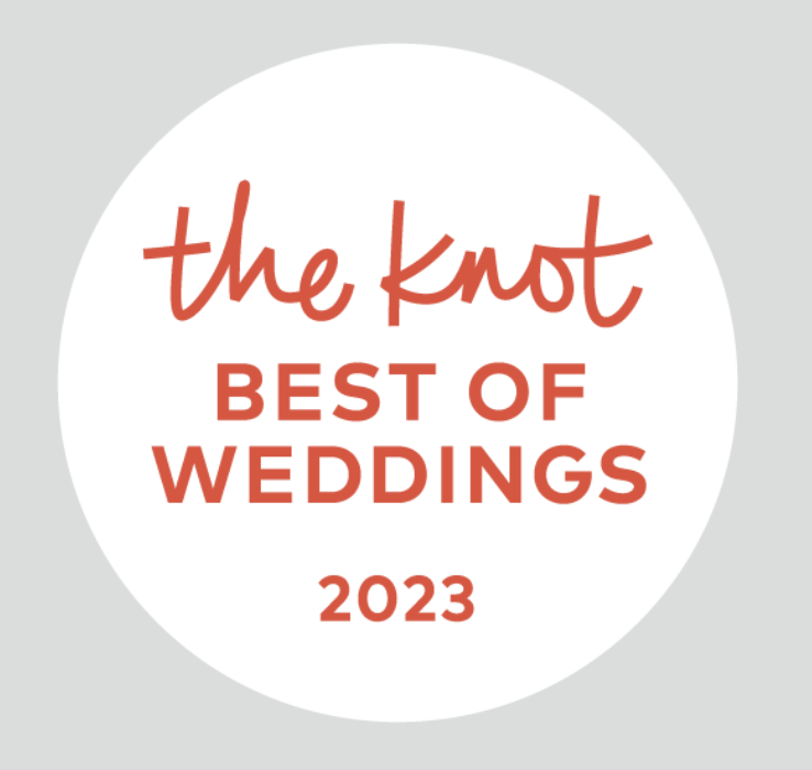 Logo for 'The Knot Best of Weddings 2023' with red and black text on a white and gray circular background.